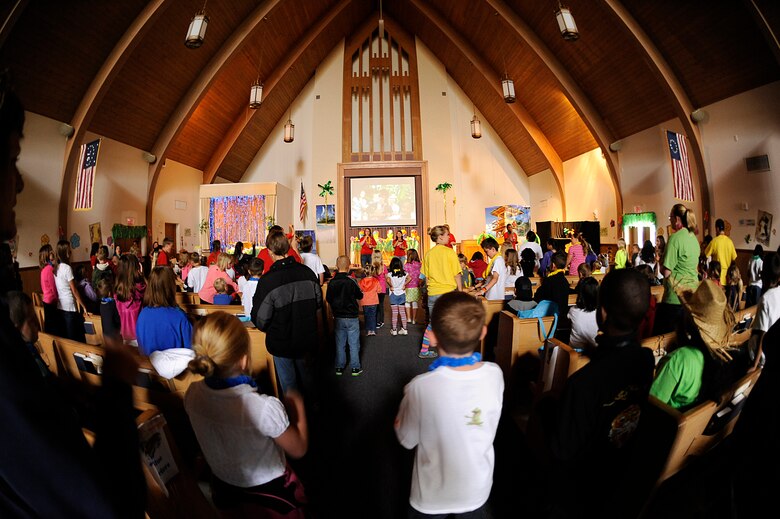 VANDENBERG AIR FORCE BASE, Calif. -- Team V members sing during a Vacation Bible School event at the base chapel here Friday, June 15, 2012. The school is in their tenth year of operation teaching 140 students in five different classes with the help of more than 50 base volunteers. (U.S. Air Force photo/Staff Sgt. Andrew Satran)  