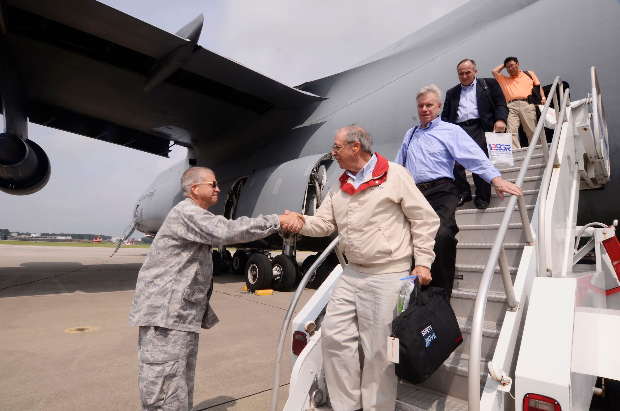 Col. Tim Tarchick, 94th Airlift Wing commander, greets visiting civic leaders from Westover Air Reserve Base, Mass. Reservists from the 439th Airlift Wing, spent a couple of days touring Dobbins and the Lockheed Martin Aeronautics Corporation, Marietta, Ga., June 14-15. (U.S. Air Force photo/Don Peek)