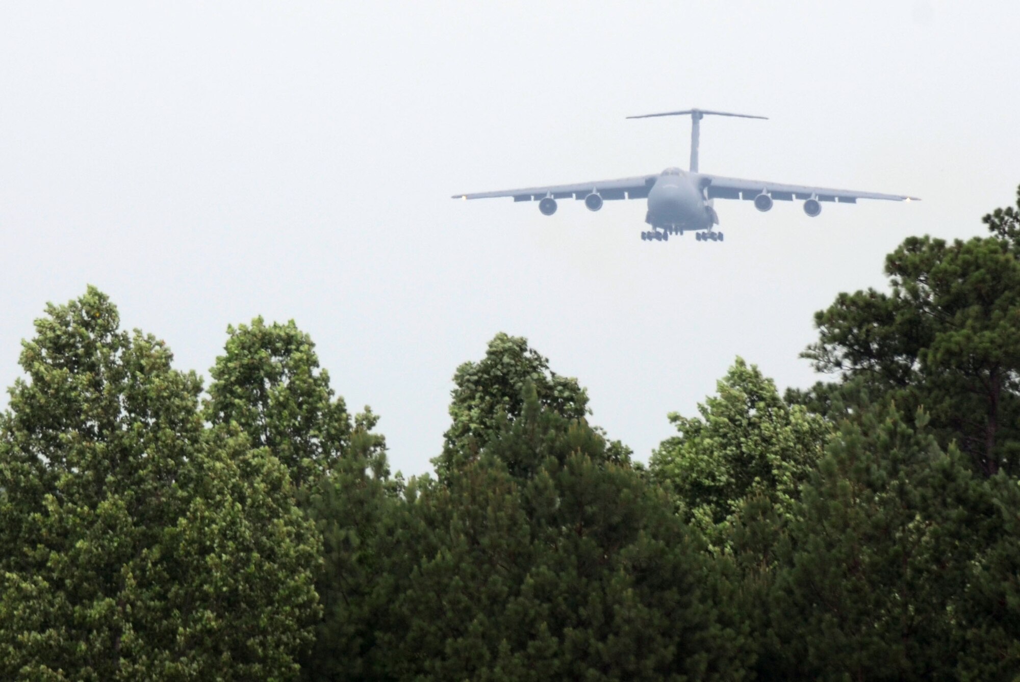 A C-5 glides into Dobbins Air Reserve Base as  Reservists from the 439th Airlift Wing, Westover Air Reserve Base, along with civic leaders spent a couple of days visiting Dobbins and the Lockheed Martin Aeronautics Corporation, Marietta, Ga., June 14-15. (U.S. Air Force photo/Don Peek)