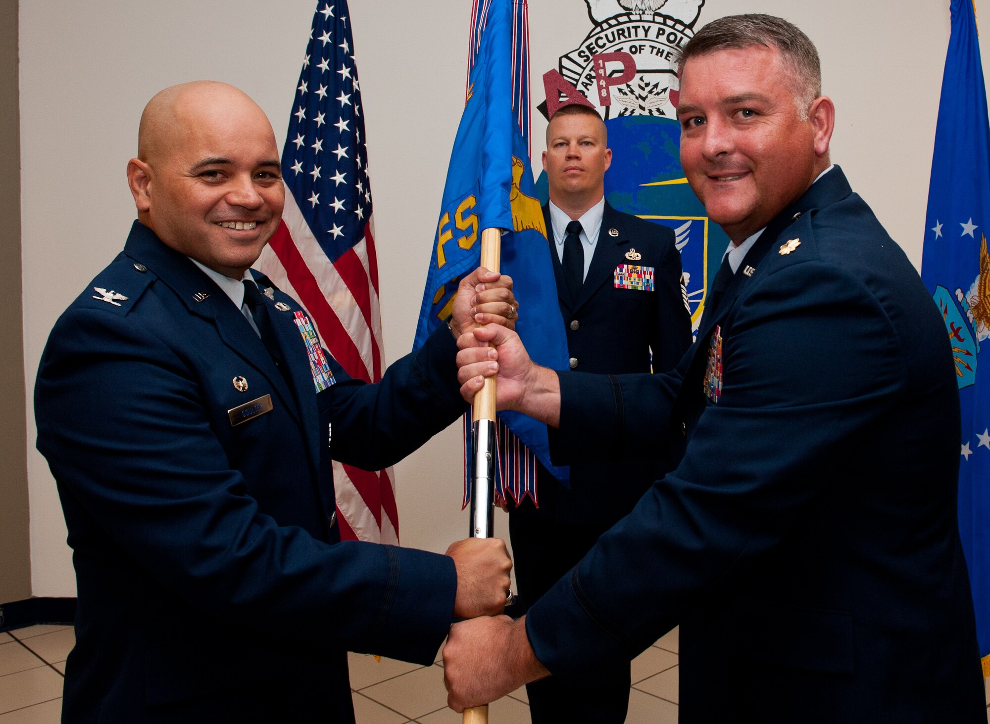 Maj.  Johnathan Bennet (right) accepts command of the 28th Security Forces Squadron from Col. Thomas Goulter, 28th Mission Support Group commander, during a change of command ceremony on Ellsworth Air Force Base, S.D., June 15, 2012. Bennet will be in command of the base’s security forces personnel, providing protection to Ellsworth’s facilities, resources, and people. (U.S. Air Force photo by Airman 1st Class Kate Thornton/Released)
