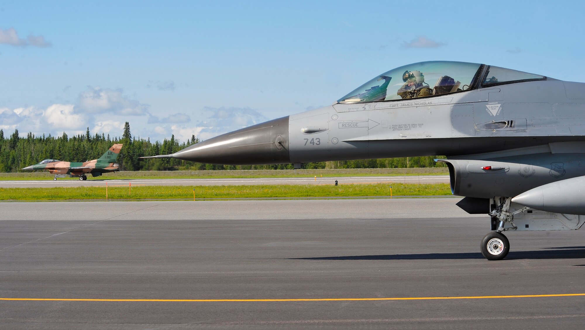 Two F-16C Fighting Falcons recover from a mission during RED FLAG-Alaska 12-2 June 11, 2012, Eielson Air Force Base, Alaska.  RF-A allows participating units to exchange tactics, techniques and procedures as well as improve interoperability.  The F-16s are assigned to the 36th Fighter Squadron, Osan Air Base, Republic of Korea, and the 18th Aggressor Squadron, Eielson Air Force Base, Alaska.  (U.S. Air Force photo/Staff Sgt. Miguel Lara III)