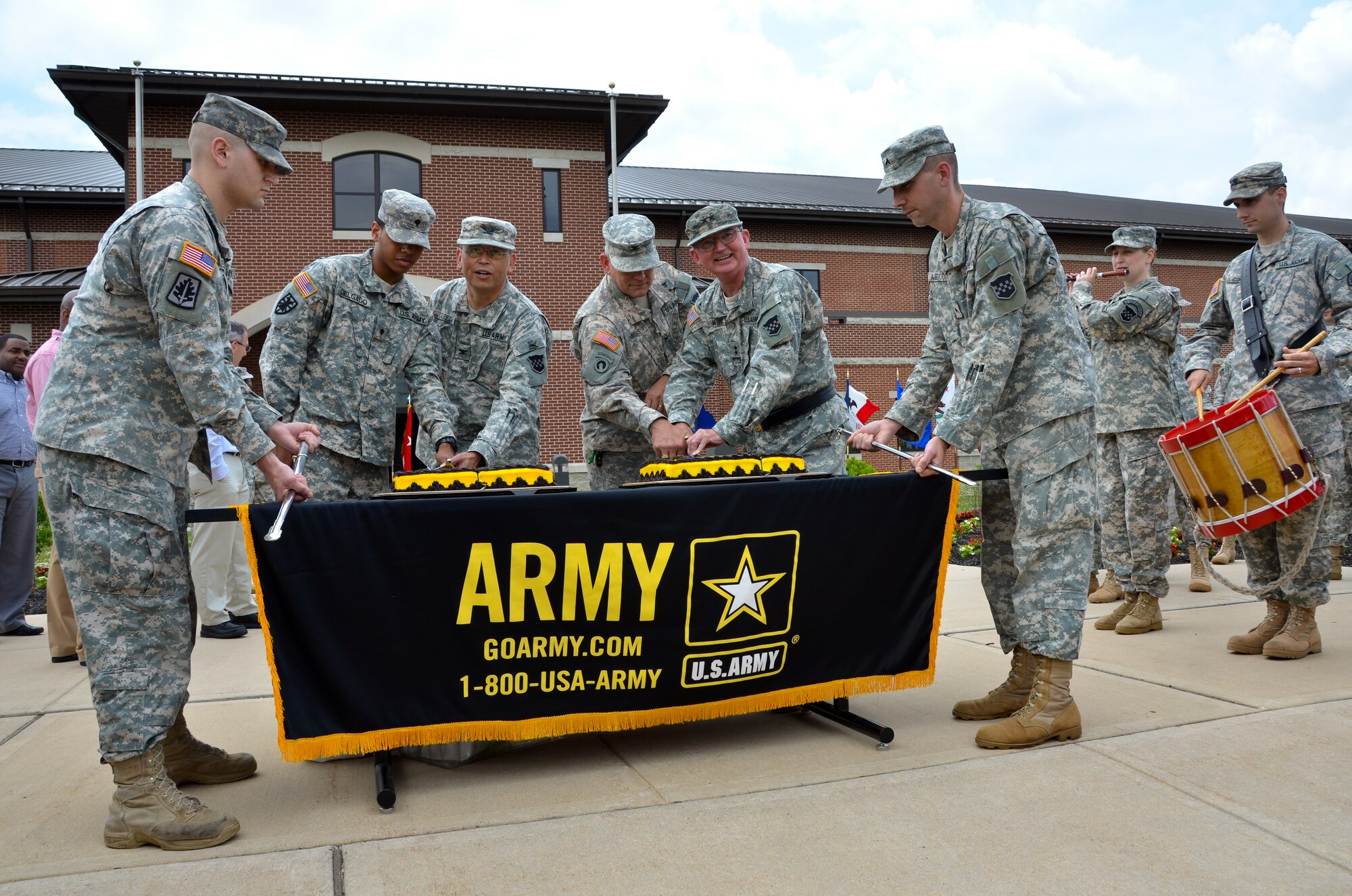 Maj. Gen. William D. Razz Waff, commanding general of the Army Reserve's 99th Regional Support Command, fifth from left, is joined by fellow Soldiers and civilians to celebrate the Army's 237th Birthday June 14 outside the Maj. John P. Pryor Army Reserve Center at Joint Base McGuire-Dix-Lakehurst, N.J. The 99th RSC acts as a "virtual installation" that provides world-class base operations support to more than 51,000 Army Reserve Soldiers, 400 units and 300 facilities for the entire Northeast Region from Maine to Virginia for the Army Reserve. The unit works to give Warrior-Citizens and their Families the finest care, support, services and training they deserve. (U.S. Army by Shawn Morris/Released)