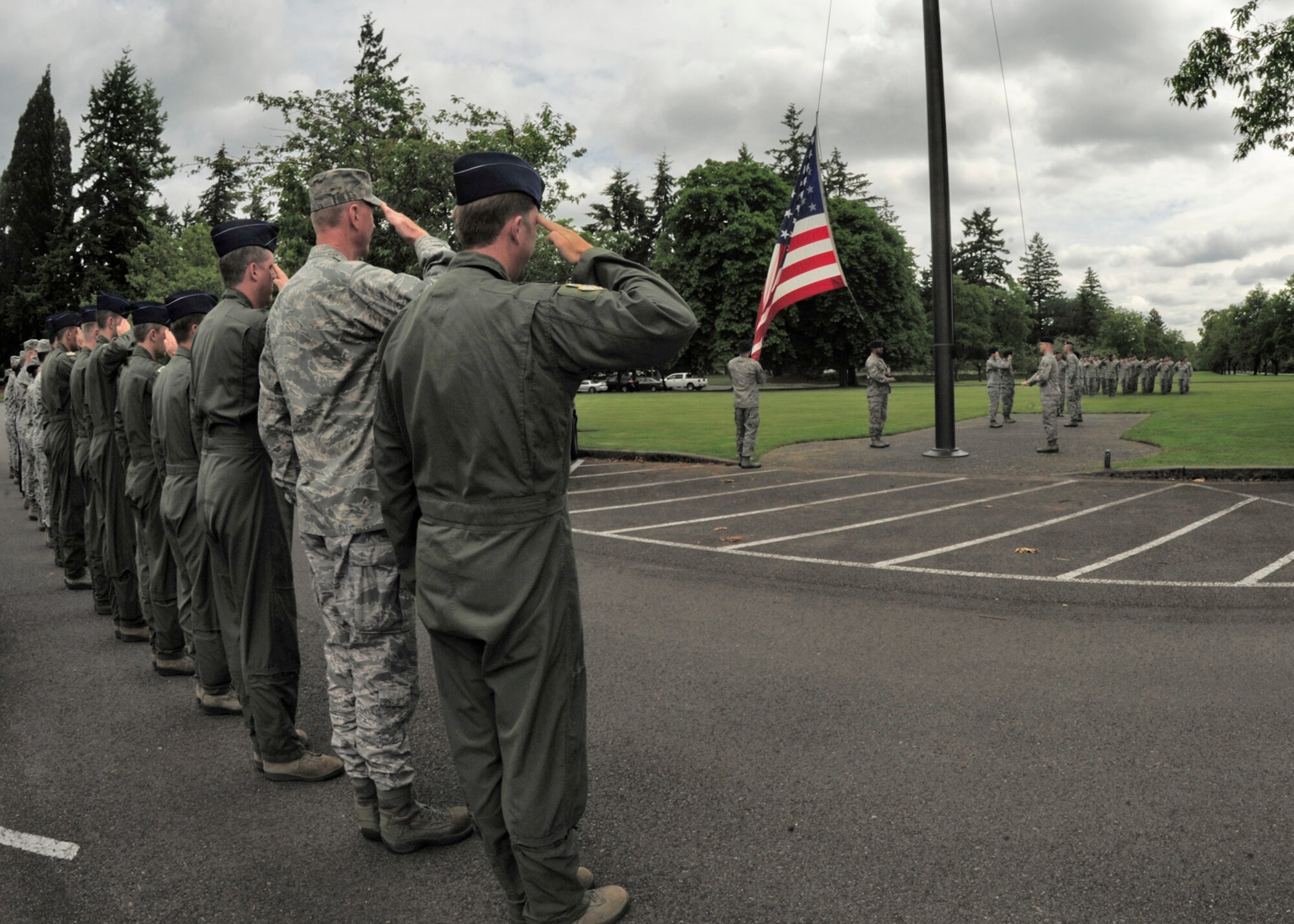 Col. Wyn Elder, 62nd Airlift Wing commander, salutes along with wing leadership during the retreat ceremony held June 14, 2012 at Joint Base Lewis-McChord, Wash. (U.S. Air Force photo/Adamarie Lewis-Page)