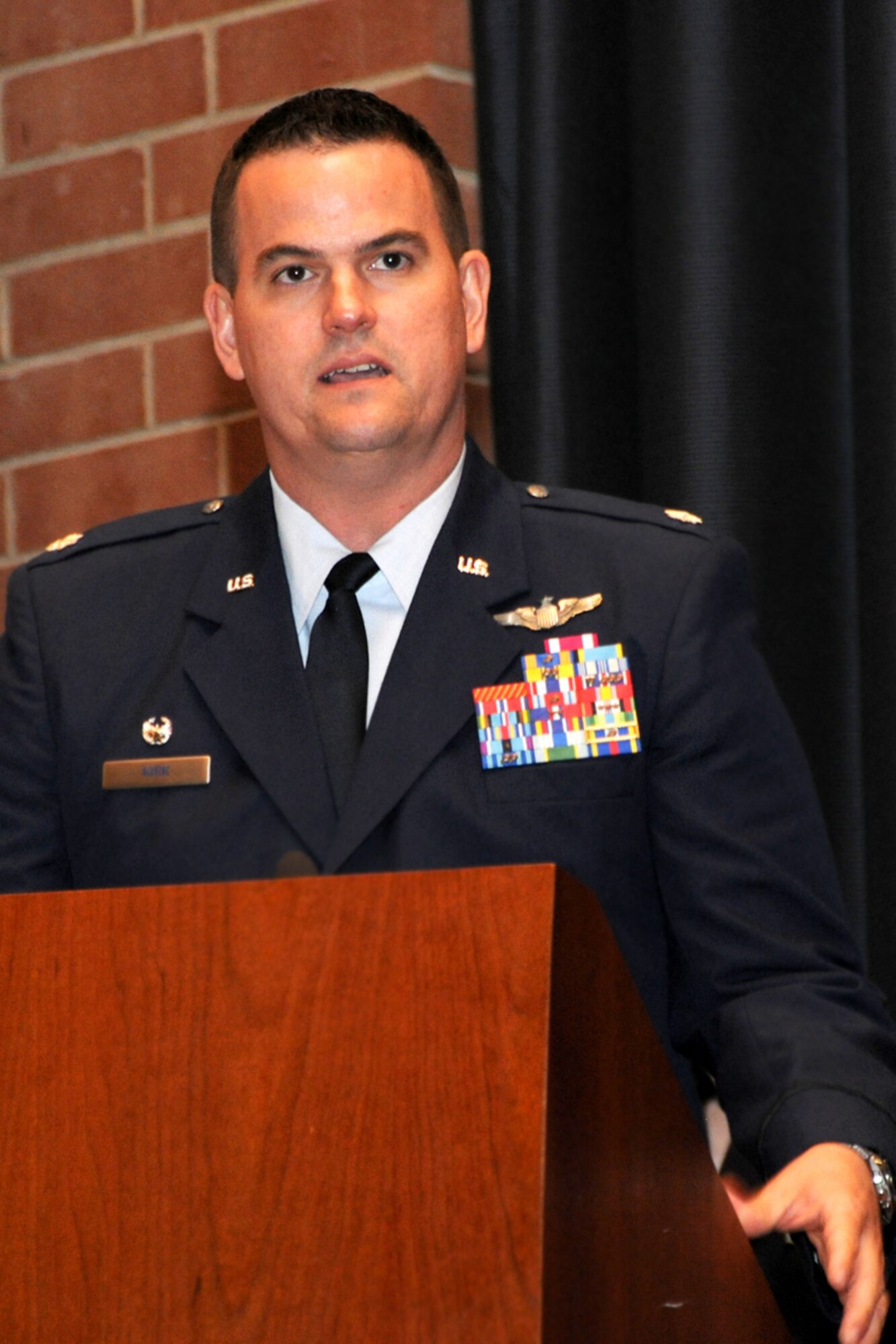 Lt. Col. Wesley Kirk, 422nd Joint Tactics Squadron commander, speaks before the crowd at Grace Peterson Hall during the 422nd JTS change-of-command ceremony June 15 at Joint Base McGuire-Dix-Lakehurst, N.J. Kirk takes over command from Lt. Col. Scott Robinson, who was the unit's first commander after being activated in March 2010. (U.S. Air Force photo by Tech. Sgt. Zachary Wilson/Released)

