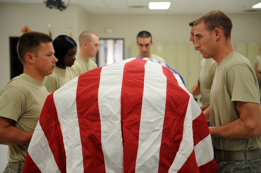 Members of the base honor guard practice as pallbearers during training at Moody Air Force Base, Ga., June 14, 2012.  Last year Moody Honor Guardsmen performed for more than 300 details requiring military honors across Moody's area of responsibility. (U.S. Air Force photo by Staff Sgt. Ciara Wymbs/Released) 