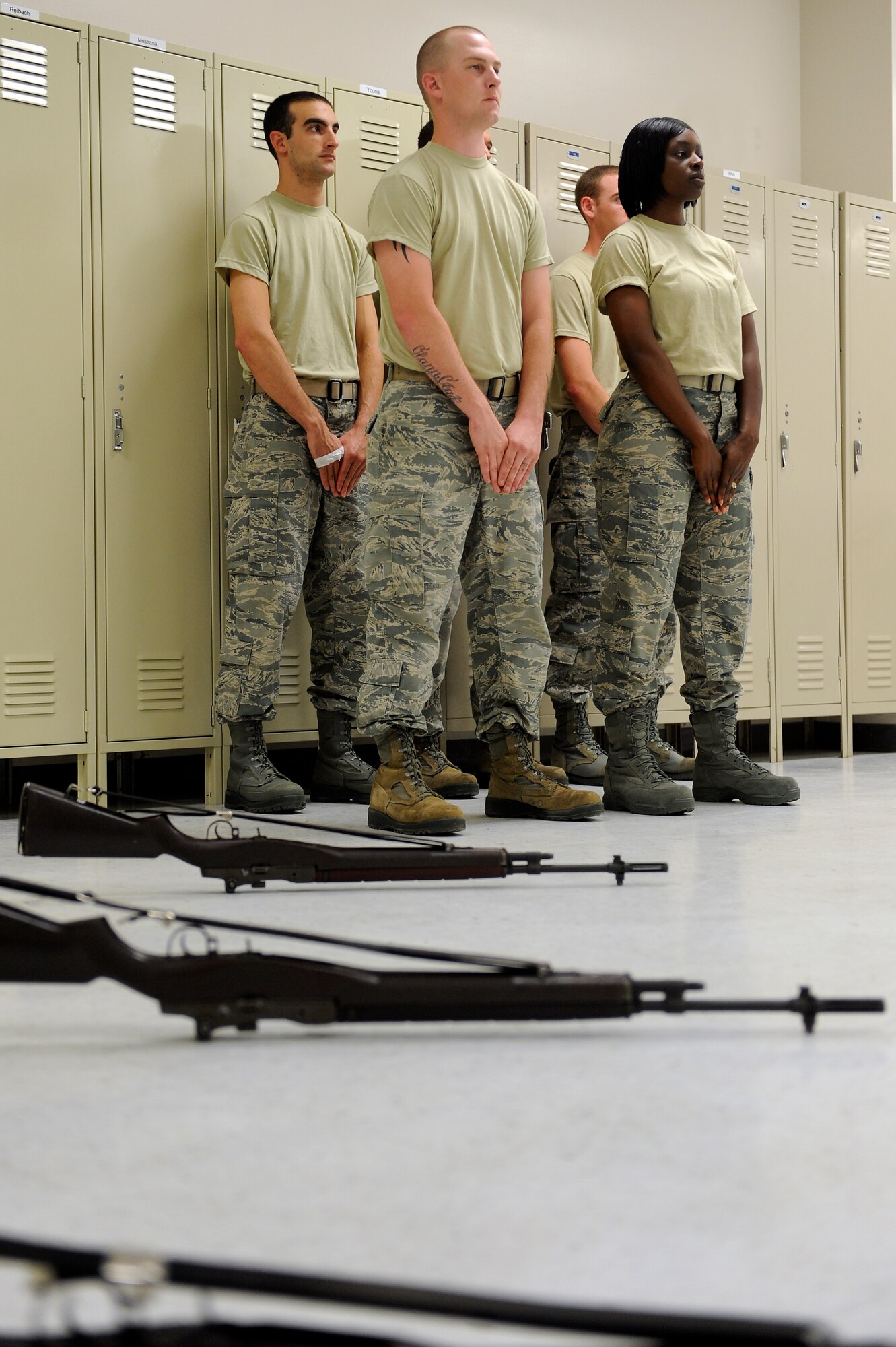 Airmen stand in a formation during honor guard training at Moody Air Force Base, Ga., June 14, 2012. The Airmen were taught proper techniques and given evaluations on their ability to perform techniques for military ceremonies. (U.S. Air Force photo by Staff Sgt. Ciara Wymbs/Released) 
