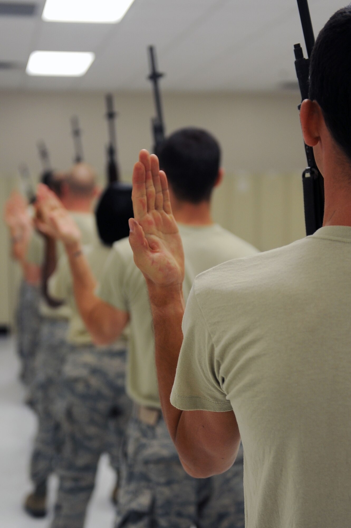 Airmen practice ceremonial procedures for a memorial service during honor guard training at Moody Air Force Base, Ga., June 14, 2012. Honor guard is a four month commitment where Airmen are taught how to perform for different events including sporting events, retirement ceremonies, memorial services and more. (U.S. Air Force photo by Staff Sgt. Ciara Wymbs/Released)
