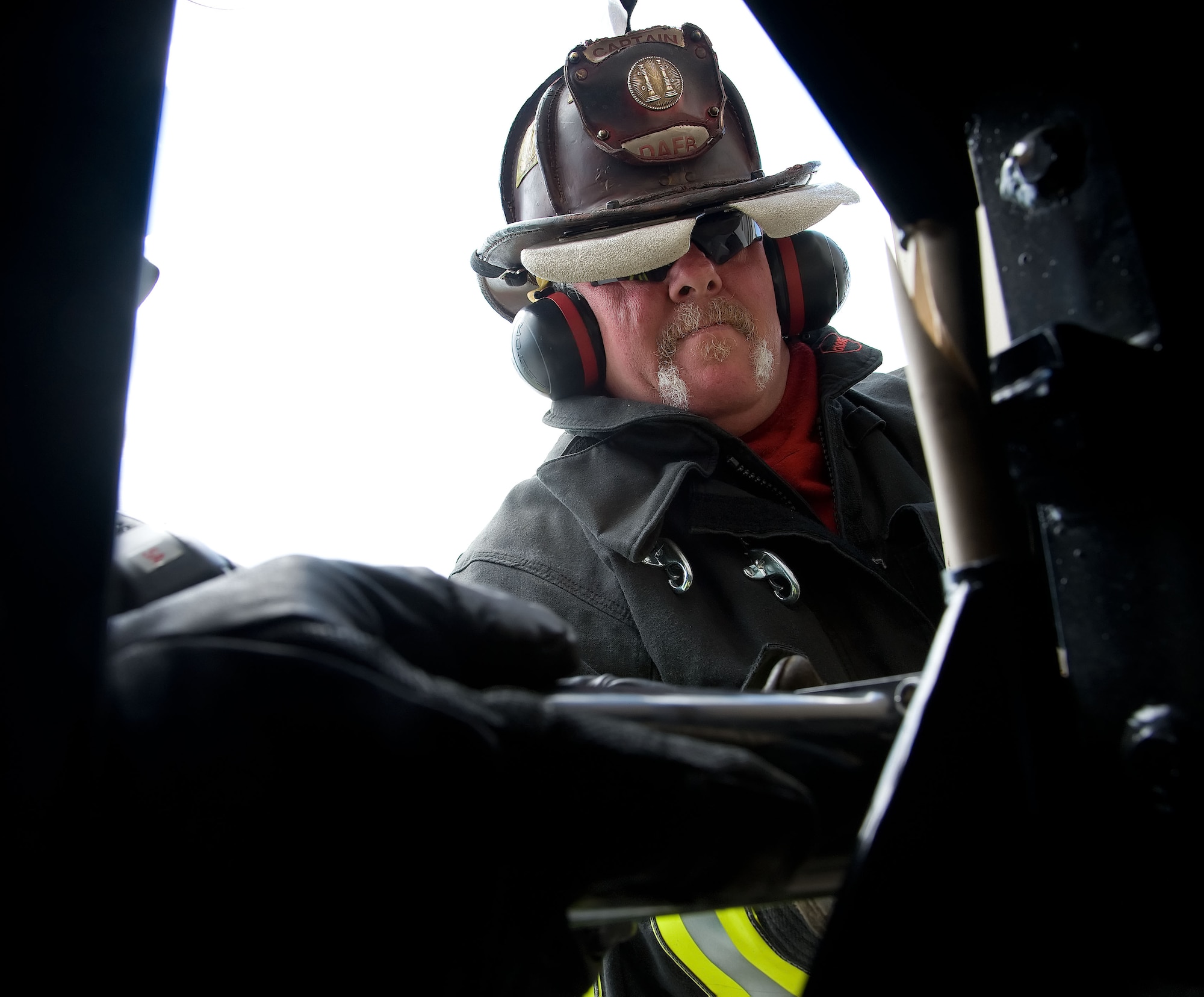 Michael Bryden, firefighter crew chief with the 436th Civil Engineer Squadron, practices forcible entry techniques June 6, 2012 at Dover Air Force Base, Del. The members of the fire protection flight regularly train for real world emergencies.  (U.S. Air Force photo by Adrian R. Rowan)