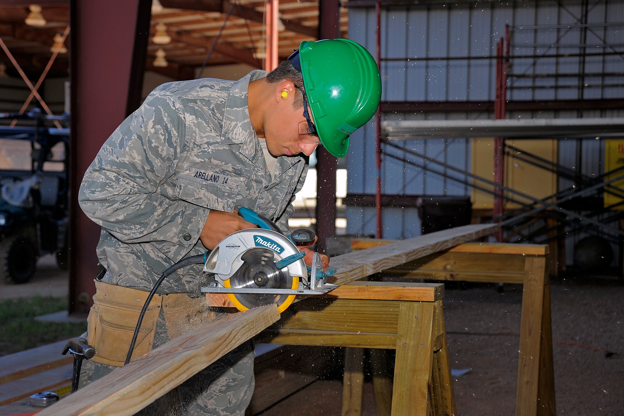 Cadet 2nd Class Nicholas Arellano of Cadet Squadron 02 uses a circular saw during the  Field Engineering and Readiness Laboratory June 4.  (U.S. Air Force Photo/Raymond McCoy)