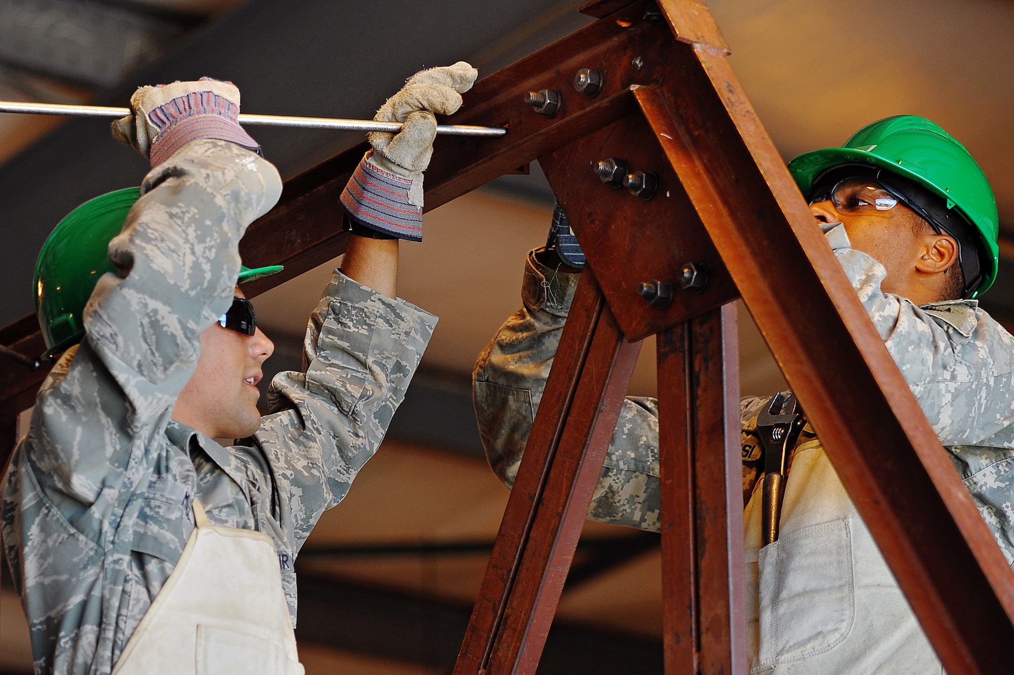 Cadets put together a support beam for one of two Hogan homes for the Navajo community in Gallup, N.M. 
 (U.S. Air Force Photo/Liz Copan)