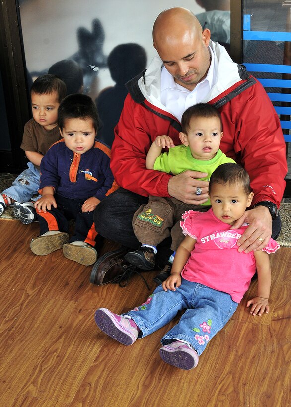 Senior Master Sgt. Jose Alvarez, Air Force military group Colombia fixed-wing program manager, accompanied members of the 571st Mobility Support Advisory Squadron, as part of an Air Mobility Command Building Partner Capacity month-long mission, and visited nearly 30 children at Asociación Amigos del Niño Ayudame, Bogota, Colombia June 9.  Airmen from both the Inter-American Air Forces Academy and 12th Air Force (Air Forces Southern) also participated in the visit.  (U.S. Air Force photo by Tech. Sgt. Lesley Waters)