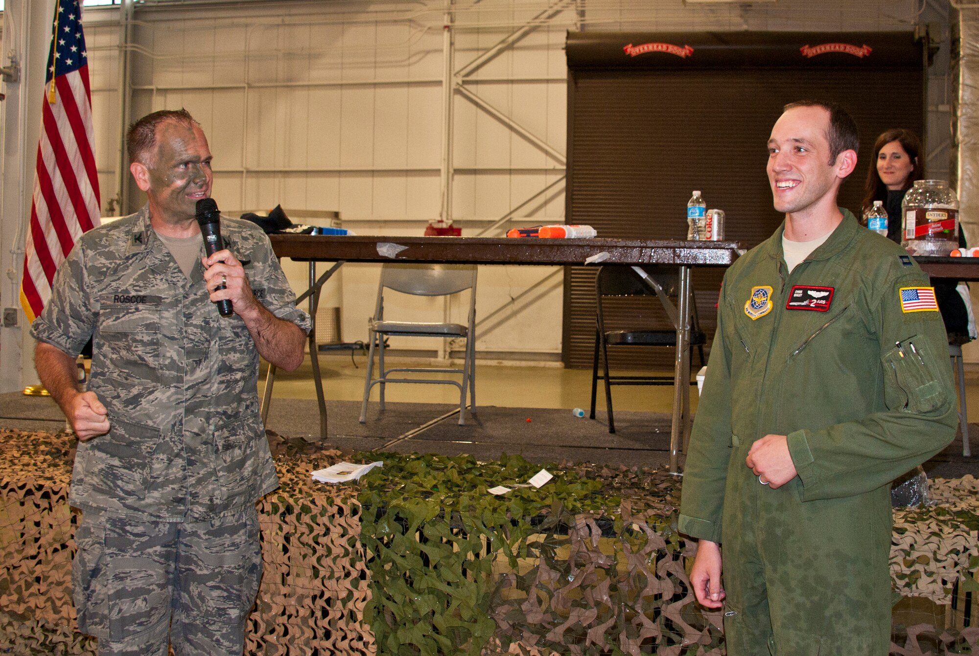Col. John Roscoe, 305th Operations Group commander, thanks Capt. Christopher Bailey, 2nd Air Refueling Squadron, for putting together the dining in at Hangar 23 June 8. He, along with several other members of the 305th OG, organized the event. (U.S. Air Force photo by Staff Sgt. David Carbajal/Released)