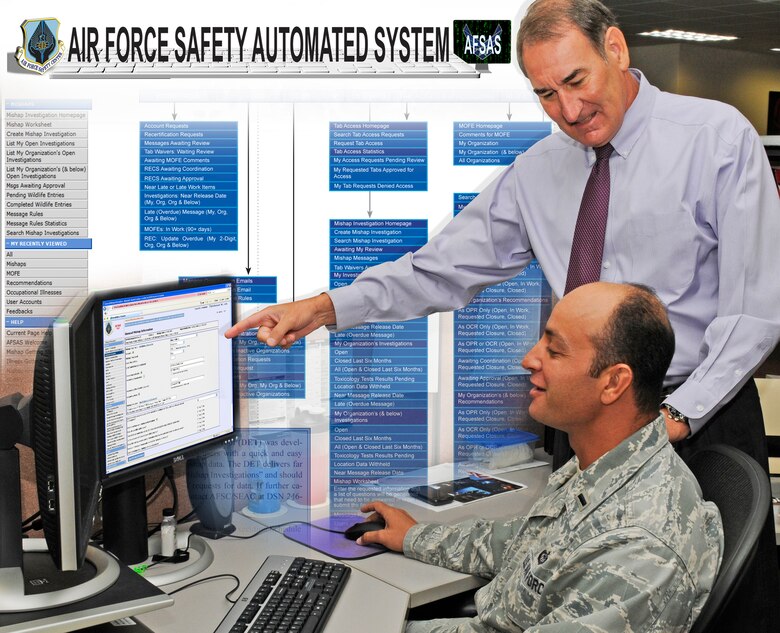 Mike Collins, deputy chief, Air Force Safety Center Analysis and Integration Division, demonstrates the the features of the Air Force Safety Automated System to 1st Lt. Brian Raphael.  AFSAS is a single integrated mishap reporting tool that provides mishap information and timely risk mitigation data to all levels of command throughout the Air Force. (Graphic by Keith Wright)