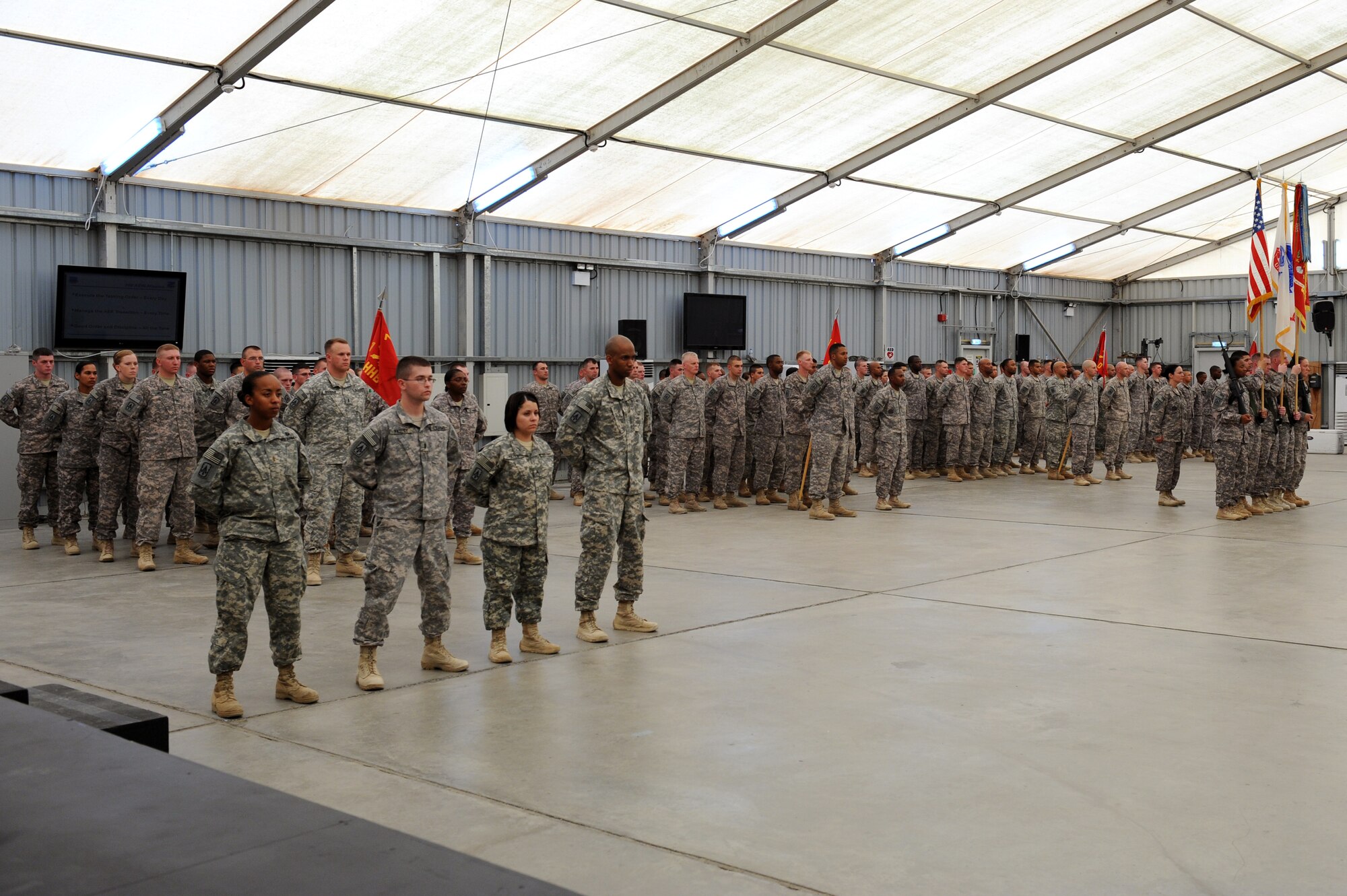 SOUTHWEST ASIA - Members of the 1st Battalion, 7th Air Defense Artillery Regiment stand at parade rest during their patching ceremony at the 380th Air Expeditionary Wing June 14, 2012. The unit, deployed from Ft. Bragg N.C., conducted its patching ceremony in conjunction with the U.S. Army's 237th birthday.  (U.S. Air Force photo/Master Sgt. Scott MacKay)