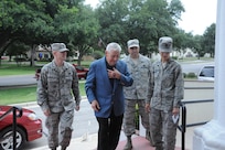 Chief Master Sgt. (ret) Robert Gaylor, 5th Chief Master Sgt. of the Air Force is greeted by (from left to right) 2nd Lt. Bryan Fagan, Chie Master Sgt. Edwin Olan and Capt. Heather Simone, Air Force Personnel Center, as he arrives at the Joint Base San Antonio-Randolph,Texas, theater June 14. Chief Gaylor spoke to JBSA-Randolph personnel about leadership. (U.S. Air Force photo by Rich McFadden) 