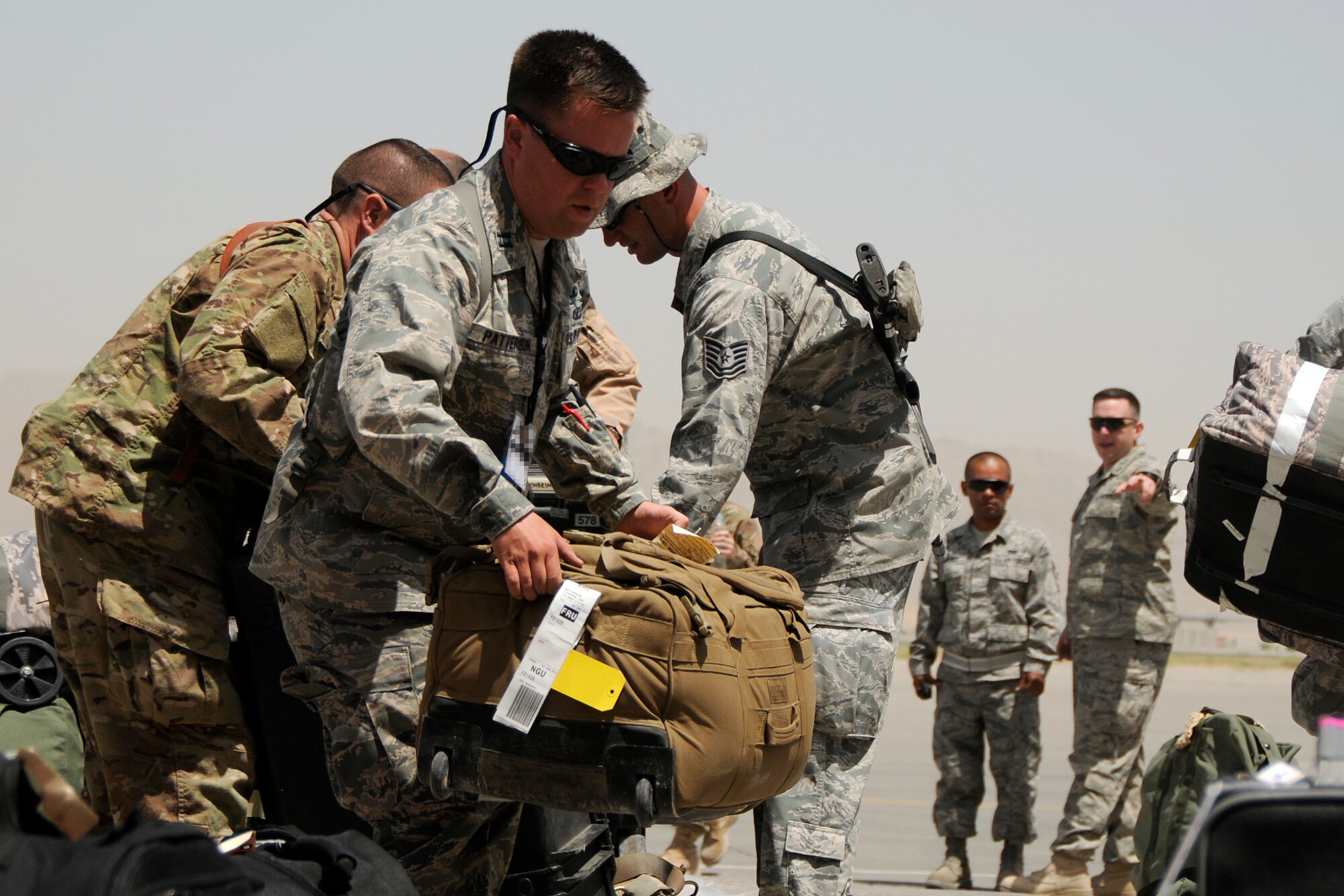 Captain Grady Patterson, the maintenance officer in charge assigned to the 451st Expeditionary Aircraft Maintenance Squadron at Kandahar Airfield, Afghanistan, helps unload luggage for members just arriving June 10, 2012. Members of the 169th Fighter Wing at McEntire Joint National Guard Base, S.C., are deployed in support of Operation Enduring Freedom. Swamp Fox F-16's, pilots, and support personnel began their Air Expeditionary Force deployment early April to take over flying missions for the air tasking order and provide close air support for troops on the ground in Afghanistan.
(U.S. Air Force photo/TSgt. Caycee Cook)
