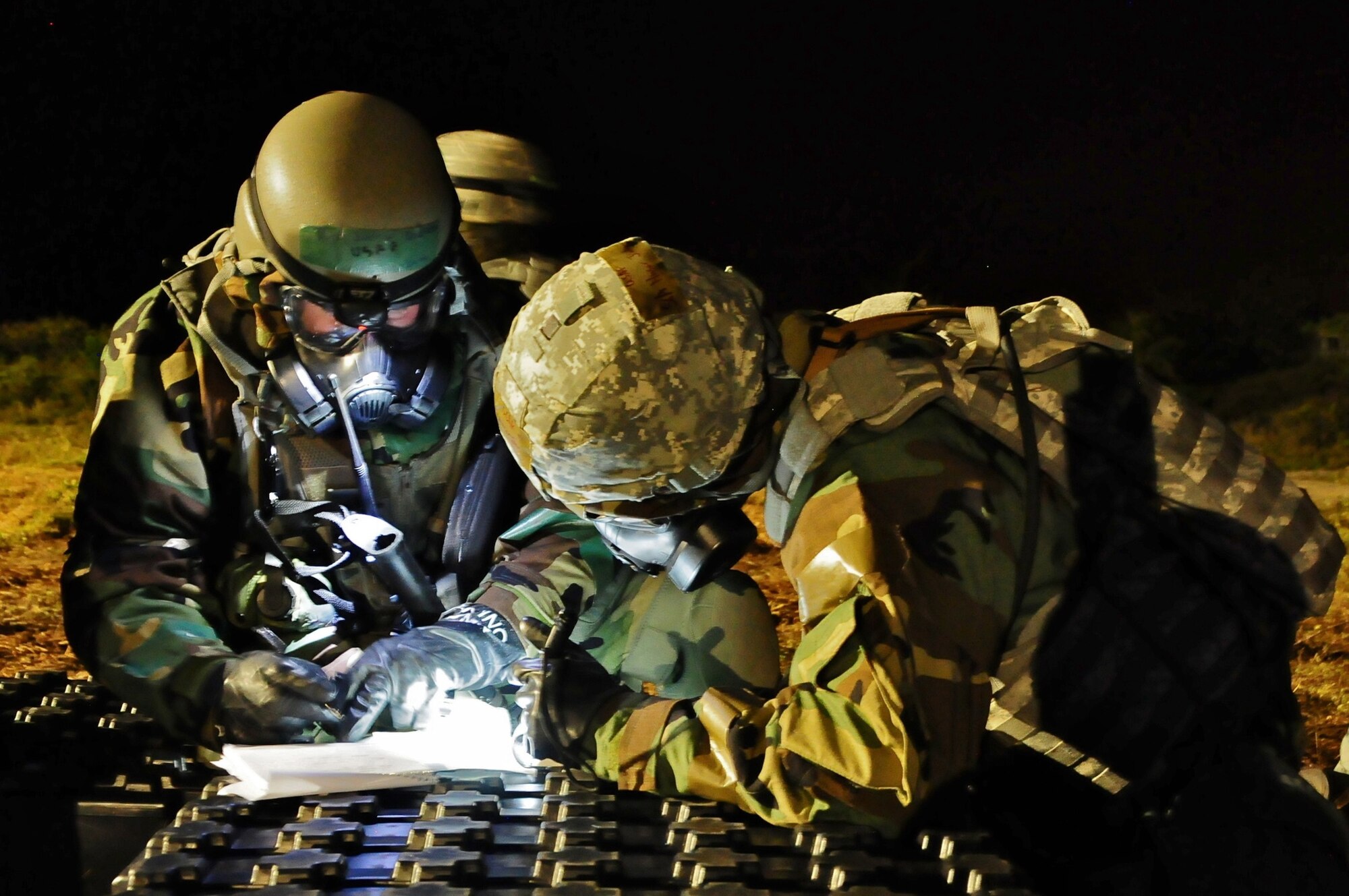 The 644th Combat Communication Squadron night shift members take accountability after a simulated chemical attack, April 24. Security and asset protection is some of the main responsibilities of Airmen assigned to the night shift in a deployed environment. (U.S. Air Force photo by Airman 1st Class Marianique Santos/Released)