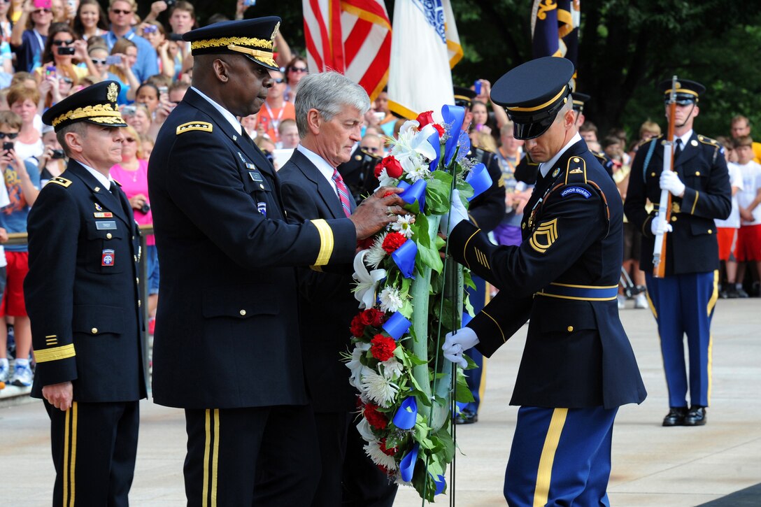 Army Secretary John M. McHugh, Army Vice Chief of Staff Gen. Lloyd Austin and Army Lt. Gen. William Troy, left, Army staff director, present a wreath in honor of the Army's 237th birthday at the Tomb of the Unknowns in Arlington National Cemetery in Arlington, Va., June 14, 2012.