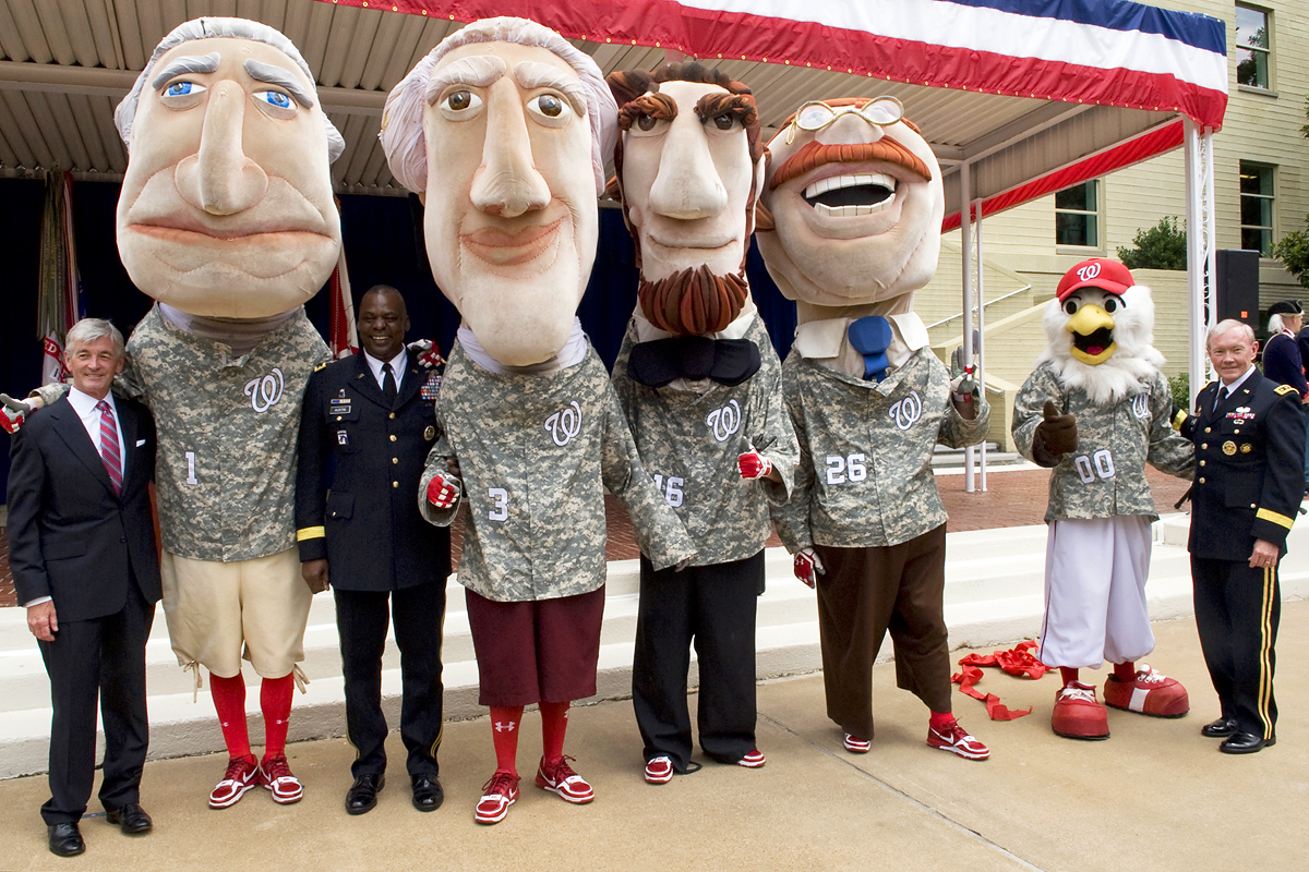 The Washington Nationals' presidential mascots and official mascot, Screech,  pose for a photo with Army Secretary