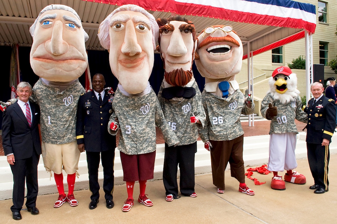 The Washington Nationals' presidential mascots and official mascot, Screech, pose for a photo with Army Secretary John M. McHugh, far left, Army Vice Chief of Staff Gen. Lloyd Austin, center, and Army Gen. Martin E. Dempsey, chairman of the Joint Chiefs of Staff, during a celebration in honor of the Army's 237th birthday in the courtyard of the Pentagon, June 14, 2012.