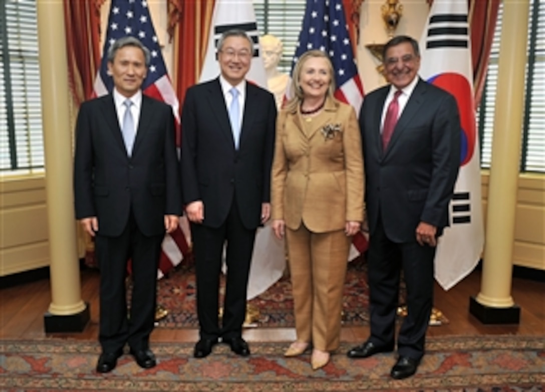 South Korean Minister of Defense Kim Kwan-jin, South Korean Minister of Foreign Affairs and Trade Kim Sung Hwan, Secretary of State Hillary R. Clinton and Secretary of Defense Leon E. Panetta pose for photographers as they meet at the U.S. Department of State in Washington, D.C., on June 14, 2012. 