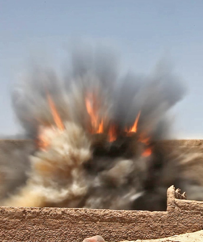 More than 25 improvised explosive devices explode after an Explosive Ordnance Disposal team conducts a controlled detonation in the Sangin District of Helmand Province, Afghanistan, June 15. Having EOD technicians spread throughout Helmand Province supporting infantry companies is critical to successful operations and has saved countless lives.