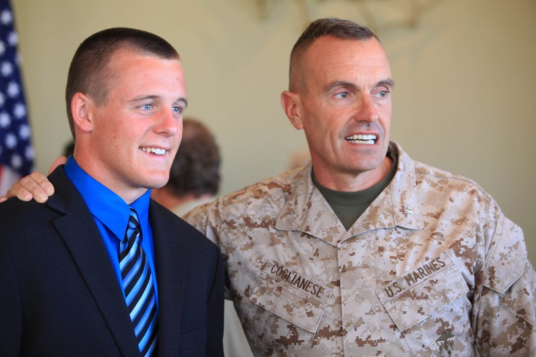 Dylan Smith, academy appointee, and Brig. Gen. Vincent Coglianese, commanding general Marine Corps Installations-West, Marine Corps Base Camp Pendleton, pose for photos after the Service Academy Breakfast held at the Pacific Views Event Center, Marine Corps Base Camp Pendleton, June 16. Coglianese congratulated the 10 academy appointees, and offered words of wisdom during the ceremony.