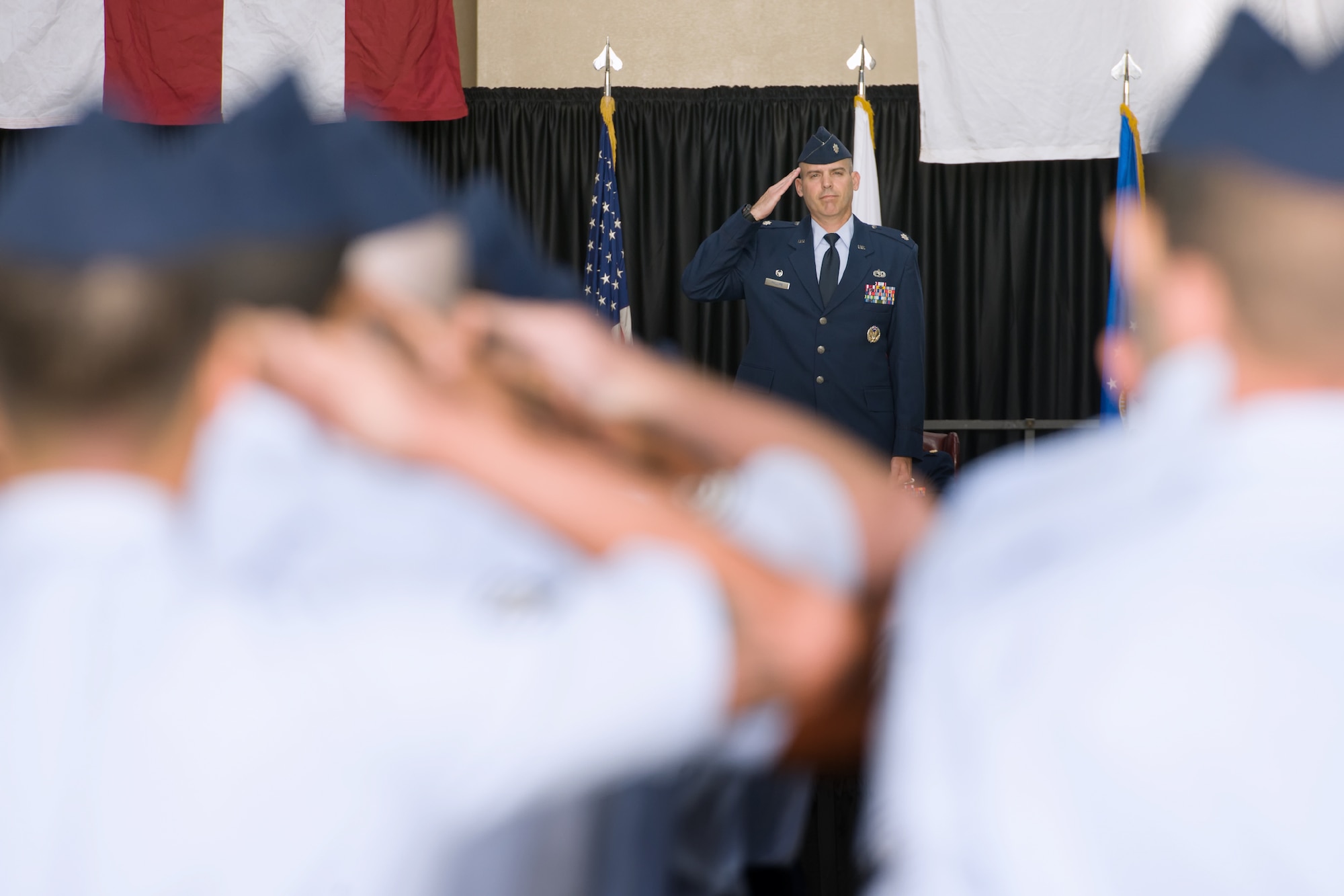YOKOTA AIR BASE, Japan -- Airmen from the 374th Maintenance Squadron present their first salute to Lt. Col. William Phillips as the 374th MXS commander during the change of command ceremony at Yokota Air Base, Japan, on June 15, 2012. (U.S. Air Force photo by Osakabe Yasuo)