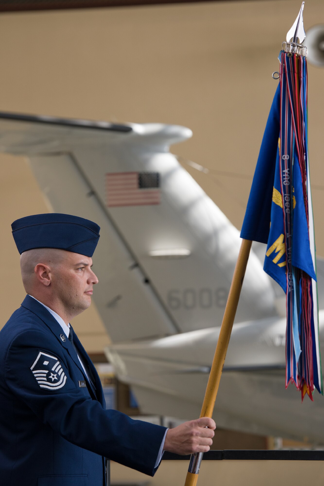 YOKOTA AIR BASE, Japan -- Master Sgt. Michael Kilgore, 374th Maintenance Squadron first sergeant, holds the guidon during the 374th MXS change of command ceremony at Yokota Air Base, Japan, on June 15, 2012. The change of command is deeply rooted in military tradition, pre-dating the reign of King Frederick of Prussia and the Norman Conquest of England. (U.S. Air Force photo by Osakabe Yasuo)
