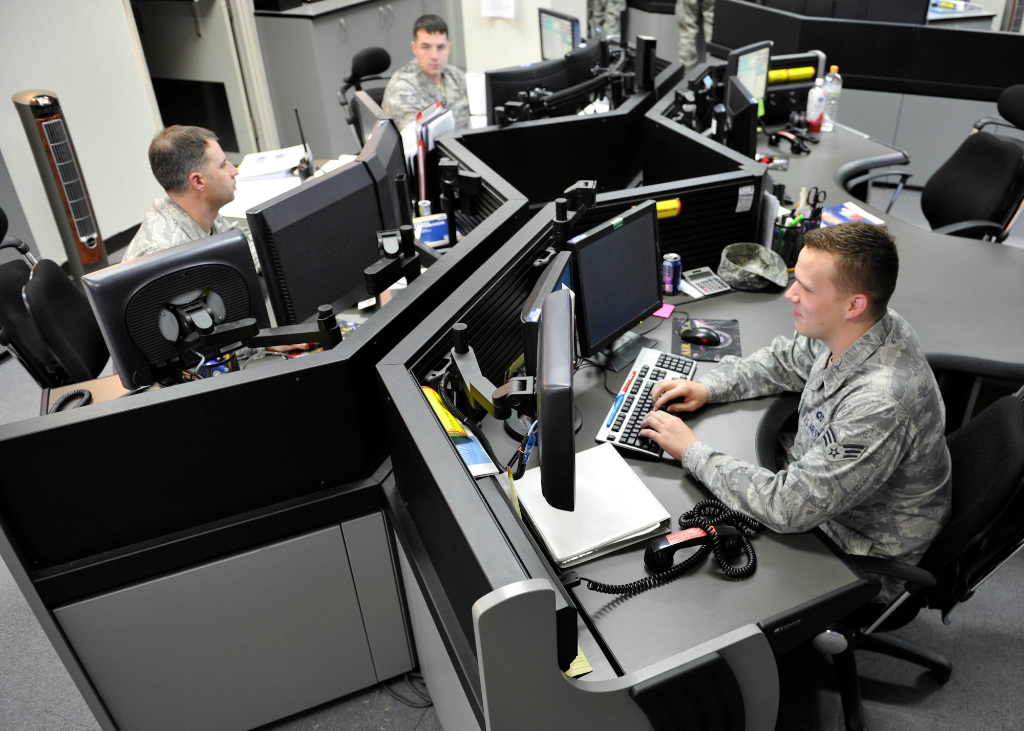 YOKOTA AIR BASE, Japan -- Air Mobility Command Center airlift operations controllers track aircraft flight information at Yokota Air Base, Japan, May 8, 2012. The AMCC at Yokota is the communications center of the 730th Air Mobility Command and receives and distributes aircraft operational and cargo movement information. (U.S. Air Force photo by Senior Airman Andrea Salazar)