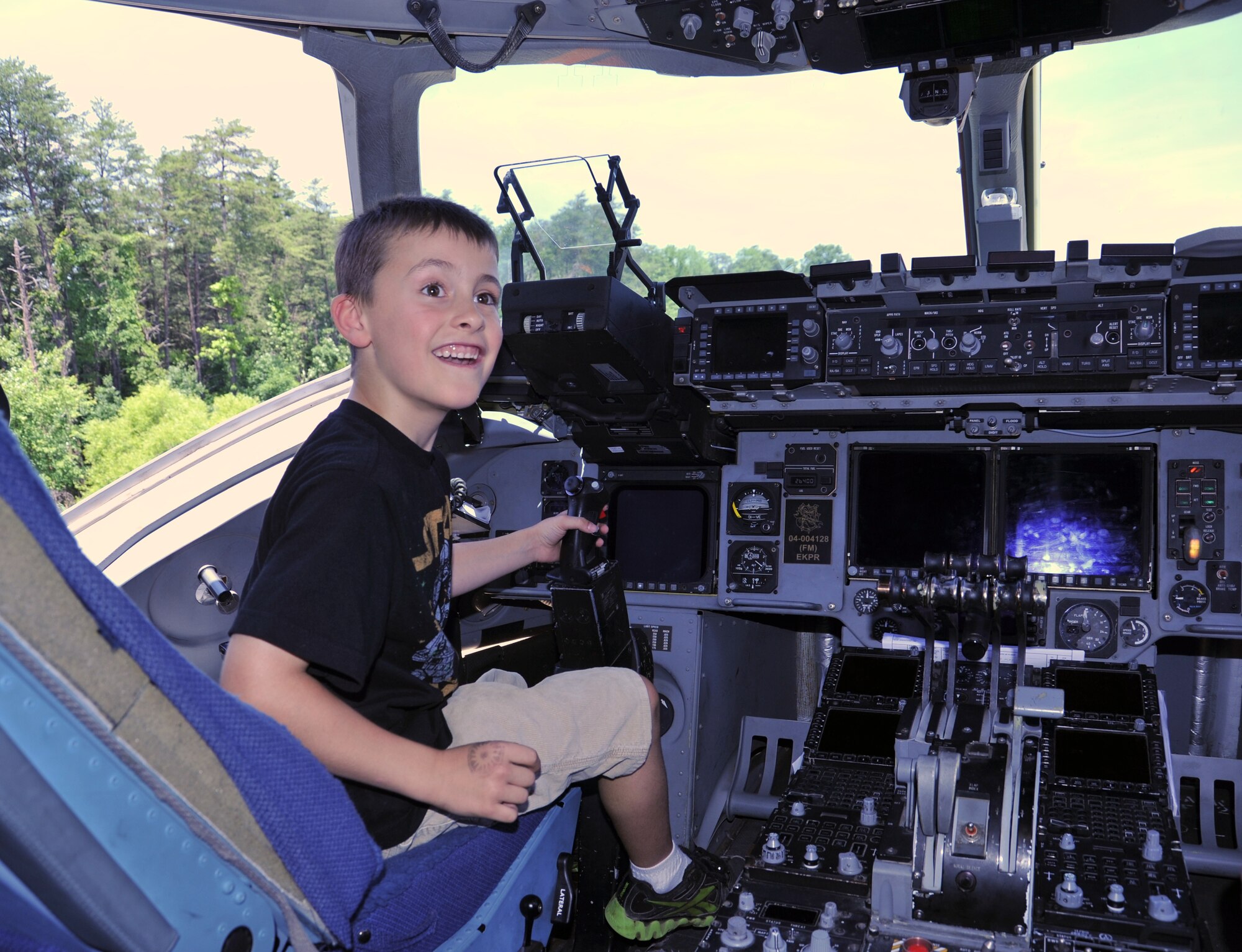 Kendall Davis, 7, explores the flight deck of a C-17 Globemaster, at "Become a Pilot Day" near Chantilly, Va., June 16, 2012. Become a Pilot Day is an annual event at the National Air and Space Museum, introducing children to careers in aviation. (U.S. Air Force photo/Airman 1st Class Alexander W. Riedel)