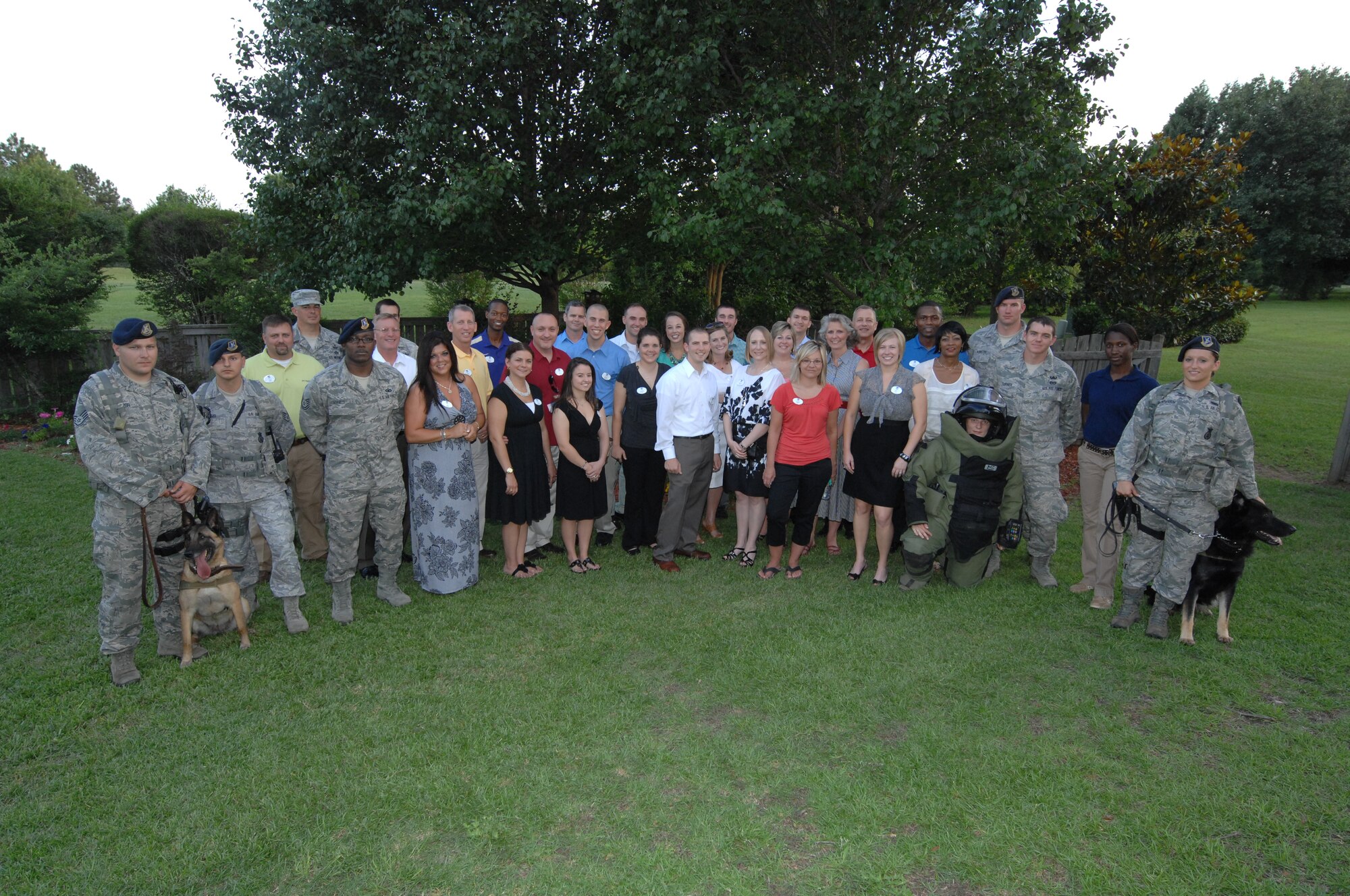 SHAW AIR FORCE BASE, S.C. - Members of the Sumter Young Professionals Organization and Shaw Air Force Base, S.C. Company Grade Officers pose for a photo while at the home of 9th Air Force Commander, Gen. Lawrence L. Wells on June 14, 2012.  (U.S.  Air Force photo by Master Sgt. Cohen A. Young/Released)