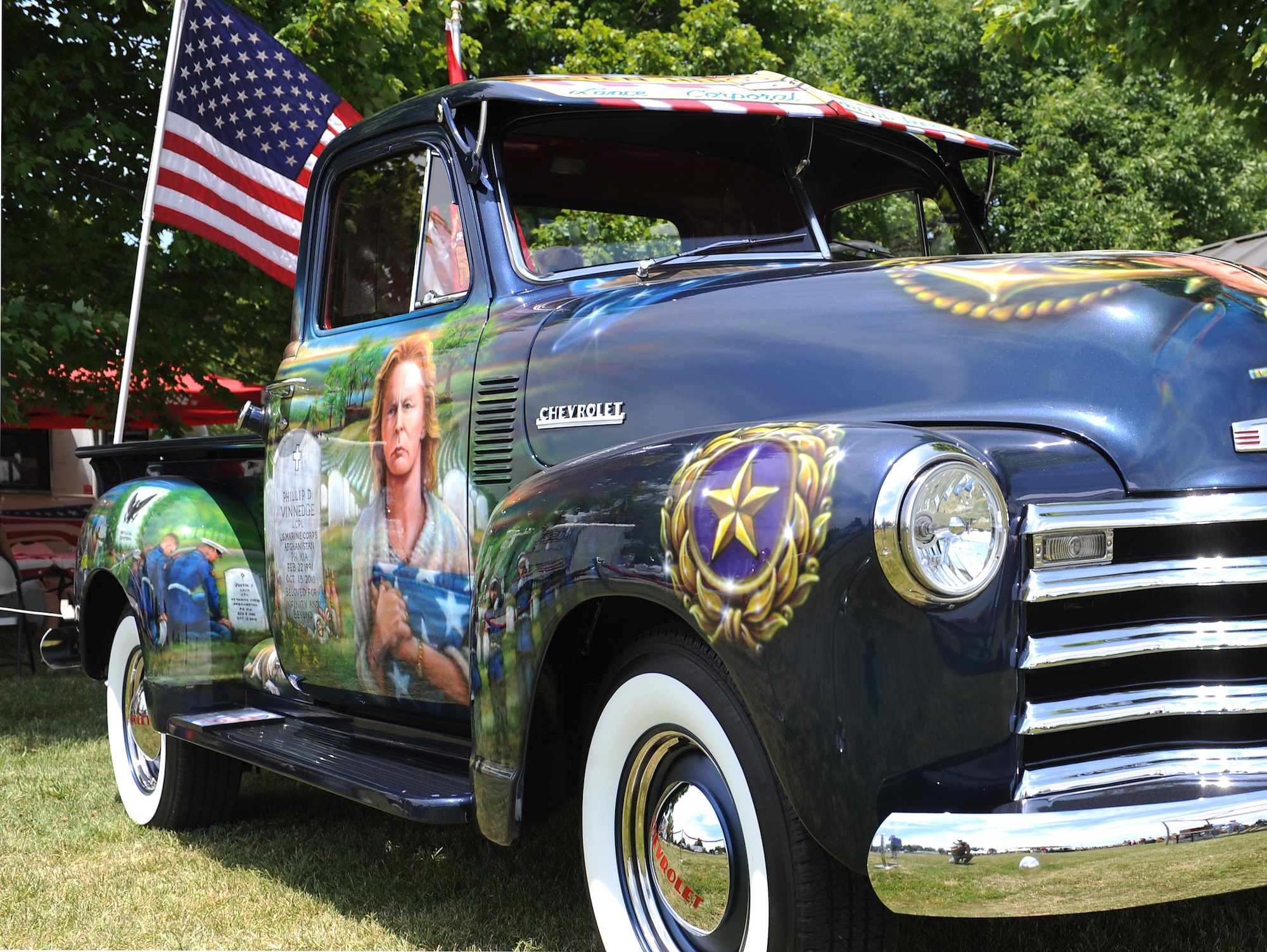 Fallen Hero's Dream Ride truck is displayed at the base wide picnic at Scott Air Force Base, Ill. June 15 , 2012. Fallen Hero's Dream Ride was formed after the death of Lance Cpl. Phillip Vinnedge who was killied in action while serving in Afghanistan. The goal of Fallen Hero's Dream ride is to create a rolling memorial to build awareness of the sacrifices our fallen military men and women have made, and to encourage support of related not for profit organizations. (U.S. Air Force photo/2nd Lt. Korey Fratini)