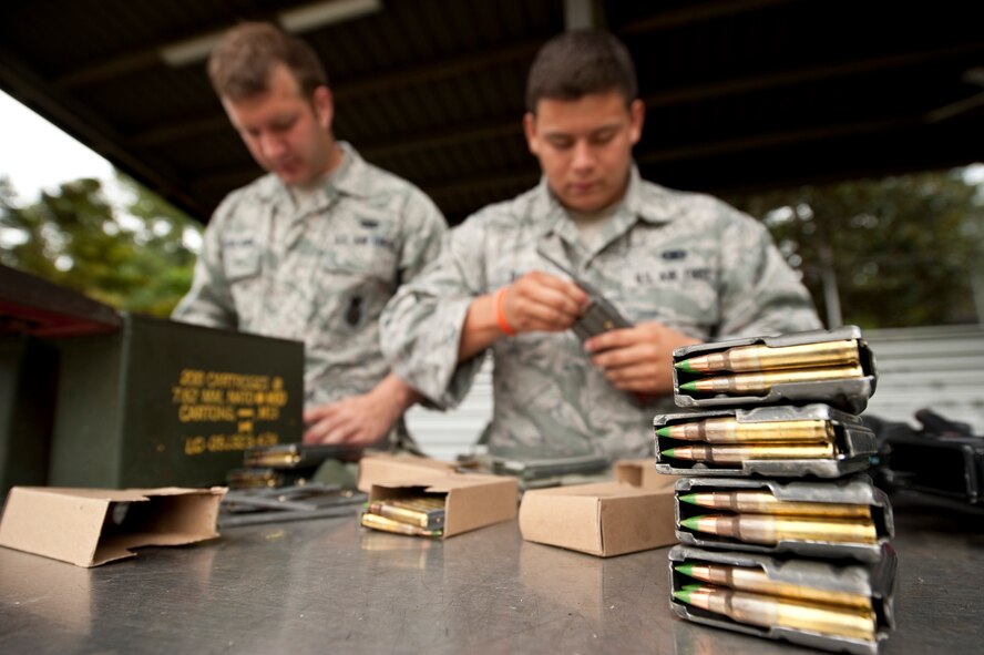 U.S. Air Force Airman 1st Class Peter Scialabba and Airman 1st Class Martin Davis, 1st Special Operations Security Forces Squadron, load magazines during the Multi-Assault Counter-Terrorism Action Capabilities course at Hurlburt Field, Fla., June 8, 2012. The National Tactical Officers Association, which provides a link to Special Weapons and Tactics units throughout the United States, conduct the five-day course. (U.S. Air Force Photo/Airman 1st Class Hayden K. Hyatt)