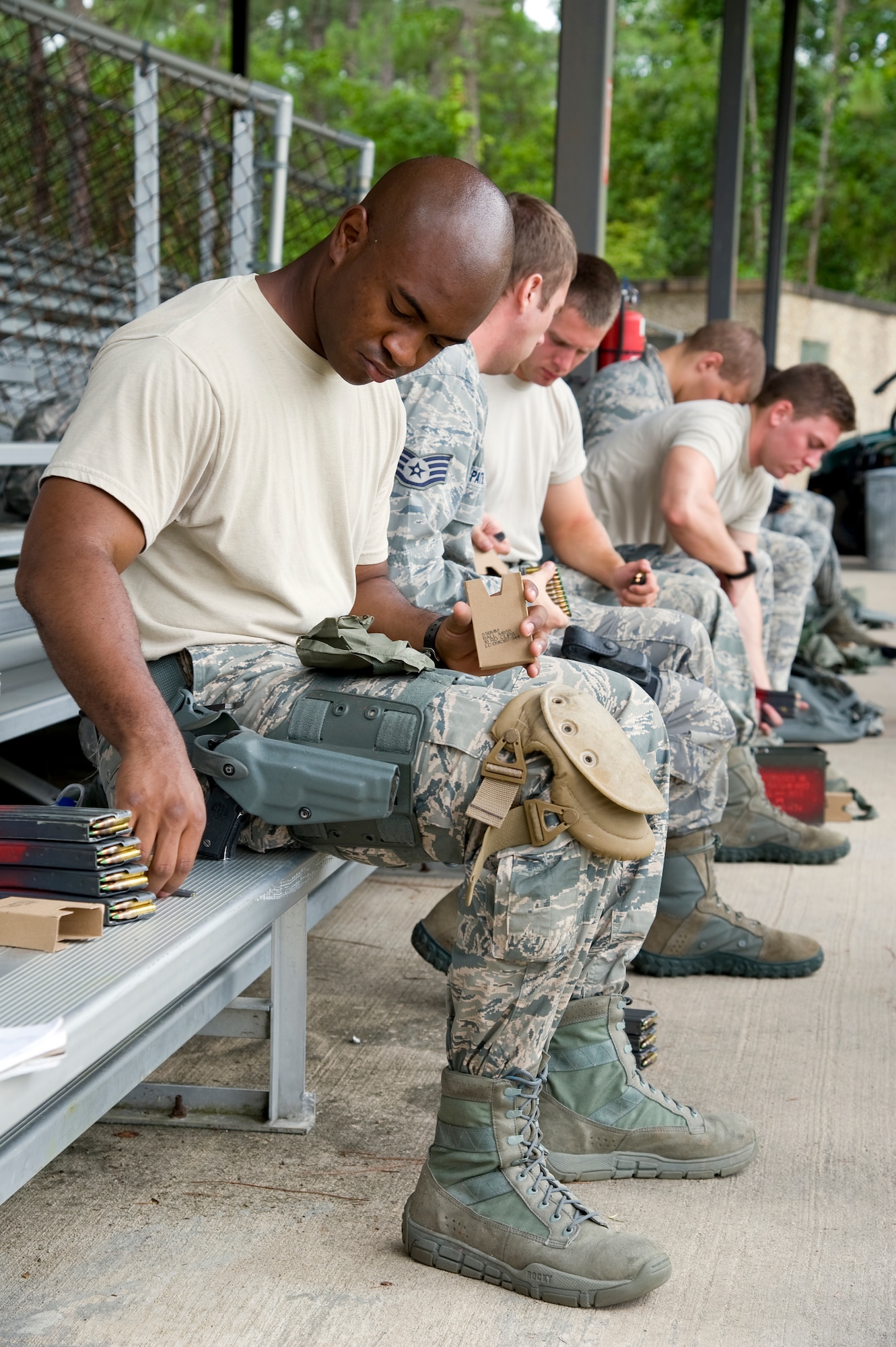 Senior Airman Jason Colas, a response force member from the 1st Special Operations Security Forces Squadron, loads rounds of munitions into magazines to prepare for the live-fire portion of the Multi-Assault Counter-Terrorism Action Capabilities course at Hurlburt Field, Fla., June 8, 2012. MACTAC helps train law enforcement in tactics to respond to an active shooter scenario.  (U.S. Air Force photo/Airman 1st Class Michelle Vickers)
