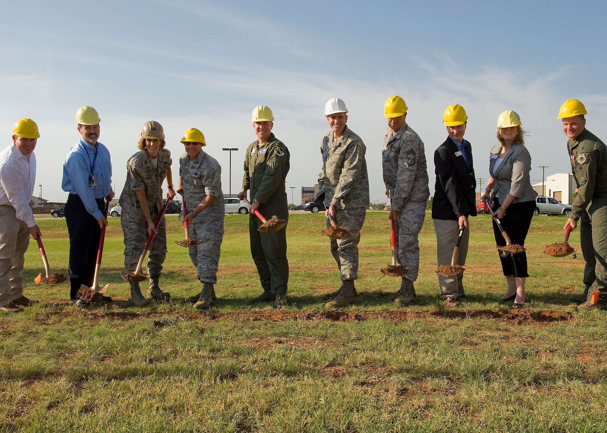 Honored guests shovel the first dirt to a new state-of-the-art C-130J simulator building during a ground-breaking ceremony June 14, 2012, at Dyess Air Force Base, Texas. The simulator will allow C-130J pilots to fly virtual missions ranging from airdrops to troop transportation without leaving the ground. (U.S. Air Force photo by Airman 1st Class Jonathan Stefanko /Released)
