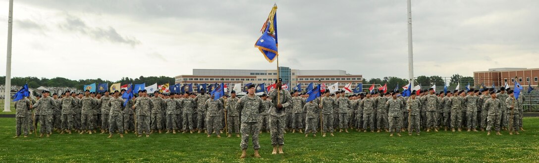 Soldiers from the 128th Aviation Brigade stand in formation at the brigade's change of responsibility ceremony at the Murphy Field Sports Complex at Ft. Eustis, Va., June 12, 2012. The ceremony welcomed Command Sgt. Maj. John J. Moore, who assumed responsibility of the unit from Command Sgt. Maj. Lloyd G. Morant. (U.S. Air Force photo by Senior Airman Wesley Farnsworth/Released)