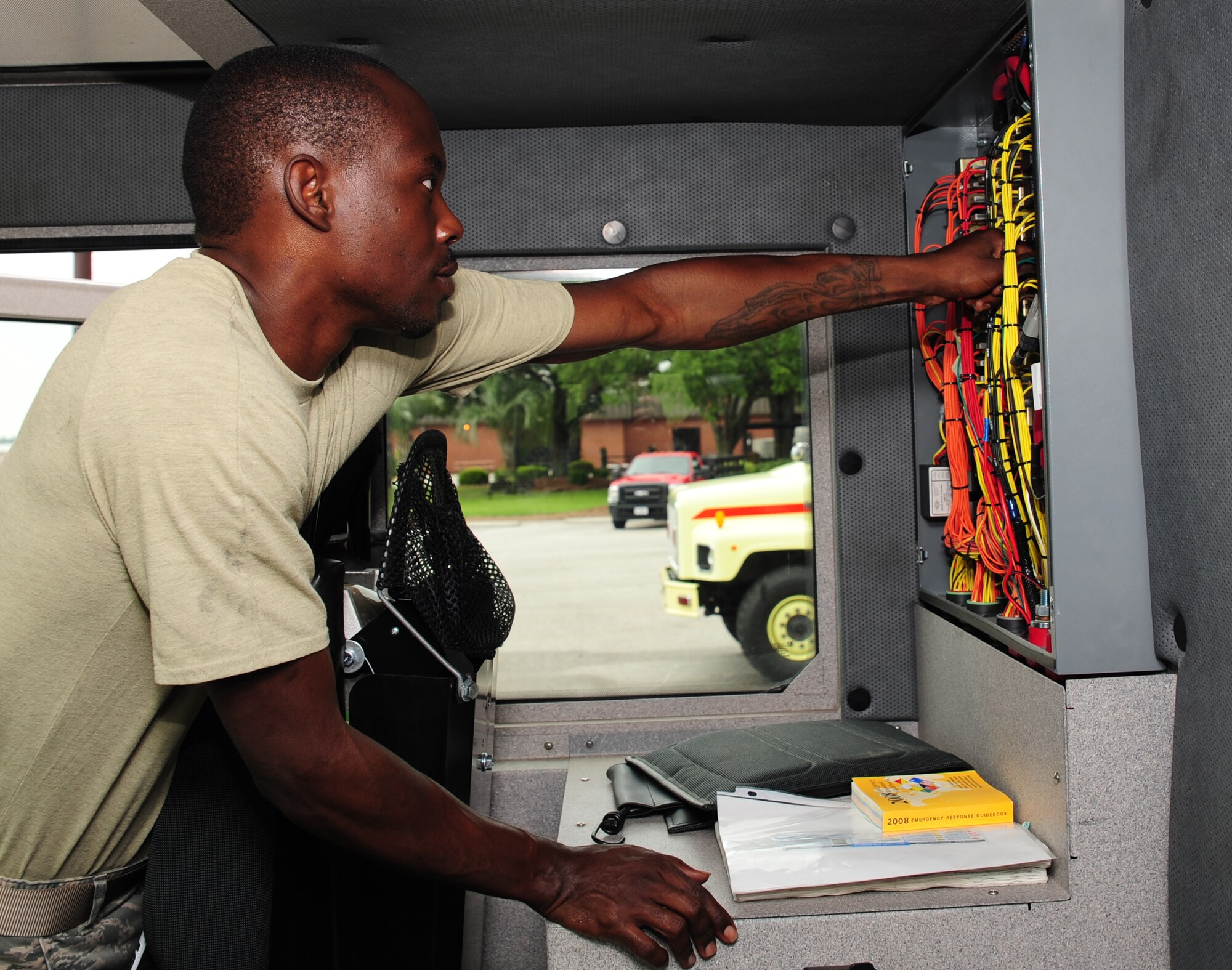 U.S. Air Force Senior Airman Anthony Burdett, 628th Logistics Readiness Squadron vehicle maintenance mechanic, checks a fire truck electrical panel, at Joint Base Charleston S.C., June 13, 2012. The 628th Airman LRS maintain a 17-vehicle fleet, including North Auxiliary Air Field. (U.S. Air Force photo/ Airman 1st Class Chacarra Walker)