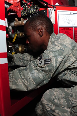 U.S. Air Force Senior Airman Anthony Burdett, 628th Logistics Readiness Squadron vehicle maintenance mechanic, checks batteries on a fire truck at Joint Base Charleston, S.C., June 13, 2012. Technical school training for vehicle maintenance mechanic's is 18-weeks long at Port Hueneme Naval Base, Calif. (U.S. Air Force photo/ Airman 1st Class Chacarra Walker)