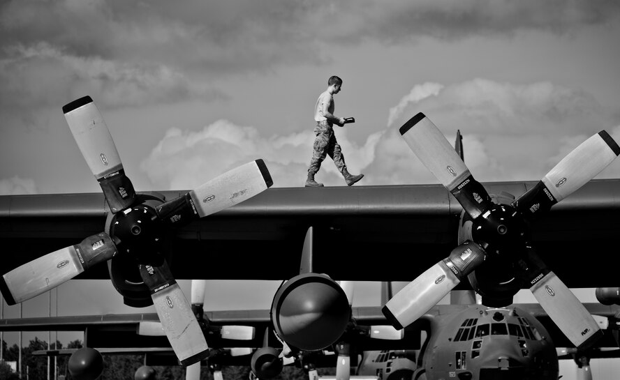 An Airman walks atop the wing of an MC-130E Combat Talon I at Duke Field, Fla.   The maintenance of the aircraft is the responsibility of the 919th Maintenance Group. (U.S. Air Force photo/Tech. Sgt. Samuel King Jr.)