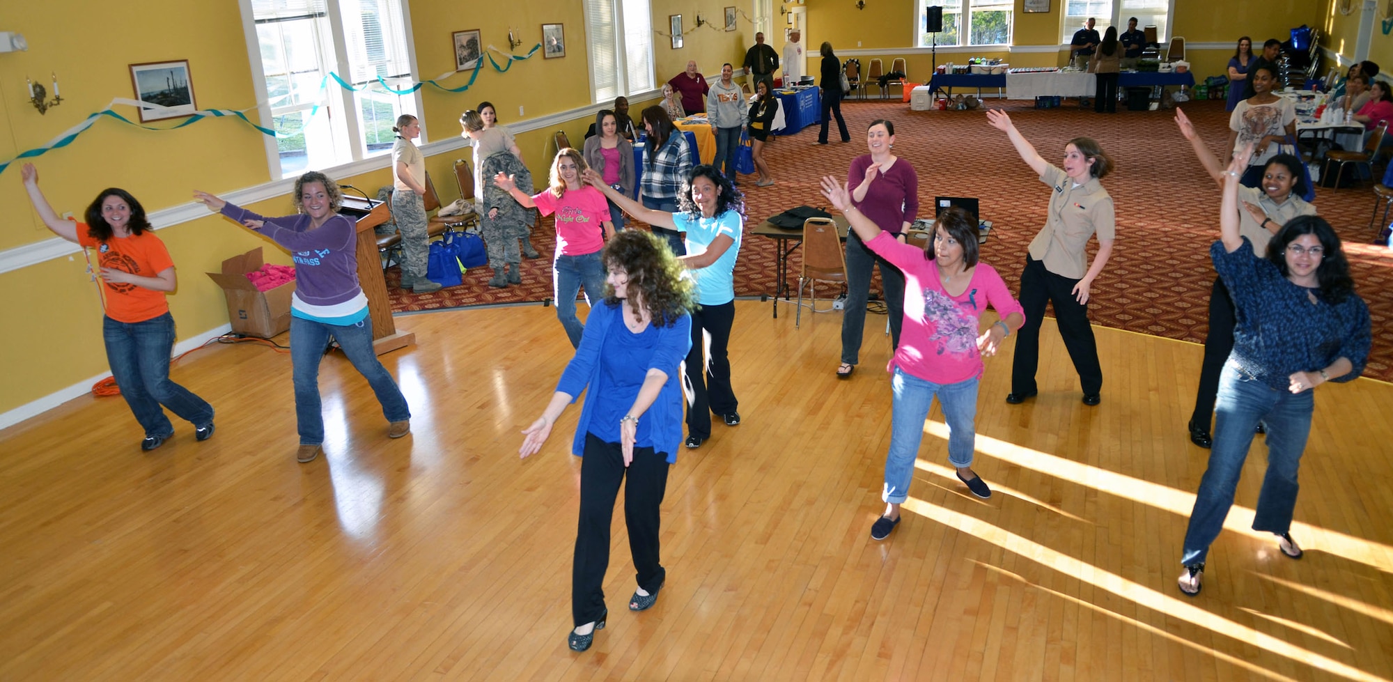 MONTEREY, Calif. --Women participate in Zumba dancing during a Girls Night Out event held at the Presidio of Monterey Weckerling Center. The event provided Sexual Assault Prevention and Response program information to the attendees on how to keep themselves healthy, safe, and demonstrate how to prevent sexual assault and other issues women face on a daily basis. (U.S. Navy photo/Mass Communication Specialist 1st Class Nathan L. Guimont)