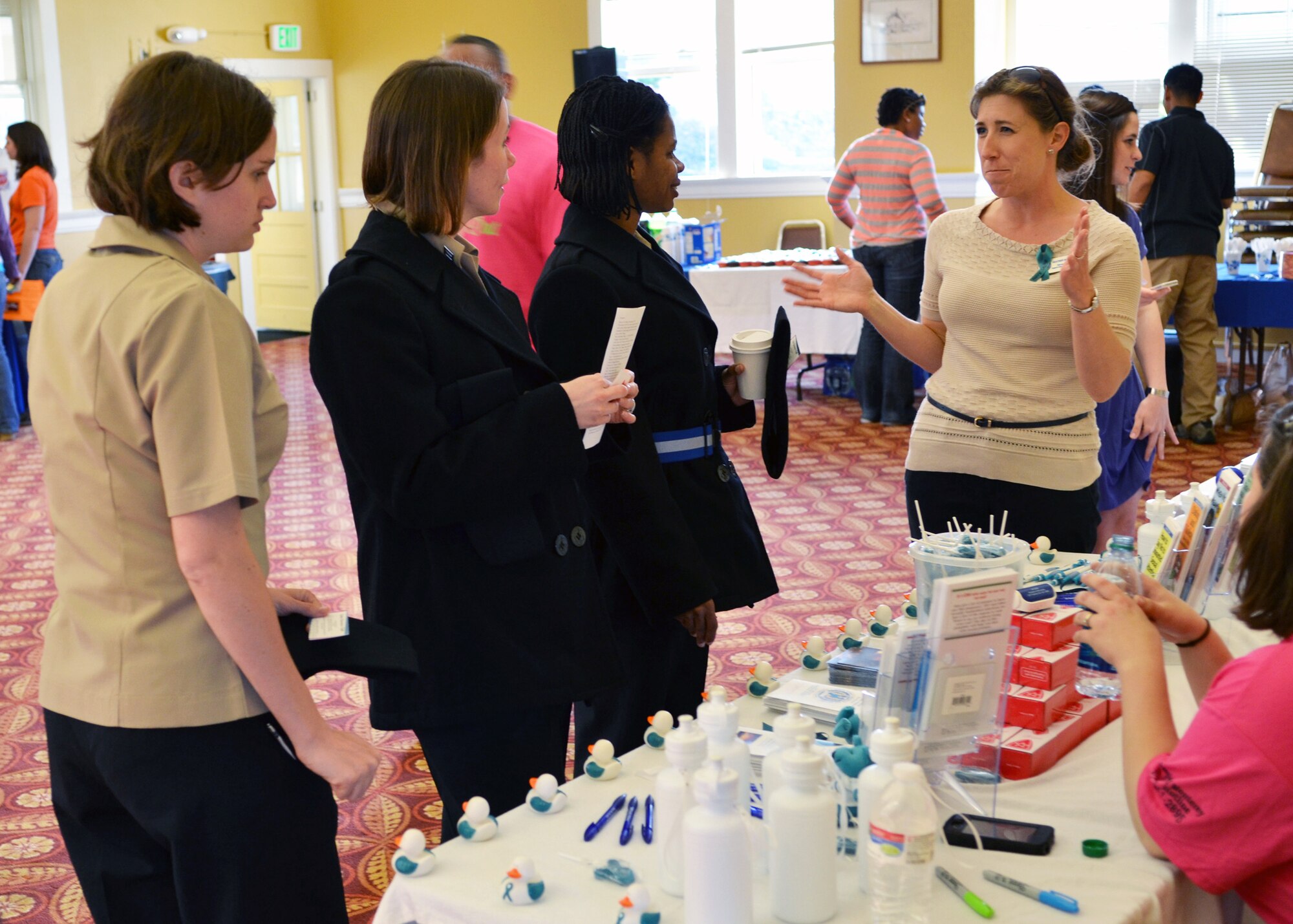 MONTEREY, Calif. --During the “Girls Night Out” event held at the Presidio of Monterey Weckerling Center, Heather Ruppert, the Sexual Assault Response Coordinator (SARC) at the Naval Postgraduate School, talks to junior Sailors from the Center for Information Dominance Unit Monterey about the role of the SARC and resources available if they are ever sexually assaulted. The event provided Sexual Assault Prevention and Response program information to the attendees on how to keep themselves healthy, safe, and demonstrate how to prevent sexual assault and other issues women face on a daily basis. (U.S. Navy photo/Mass Communication Specialist 1st Class Nathan L. Guimont)