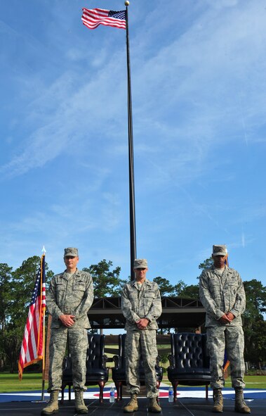 From left to right, U.S. Air Force Col. Billy Thompson, 23d Wing commander, Col. Mark Ruse, outgoing 23d Mission Support Group commander, and Col. Edward Ford, incoming 23d MSG commander, bow their heads during a change of command ceremony invocation at Moody Air Force Base, Ga., June 15, 2012. A change of command is a military tradition where outgoing commanders relinquish command and incoming commanders take charge of the unit. (U.S. Air Force photo by Staff Sgt. Stephanie Mancha/Released)