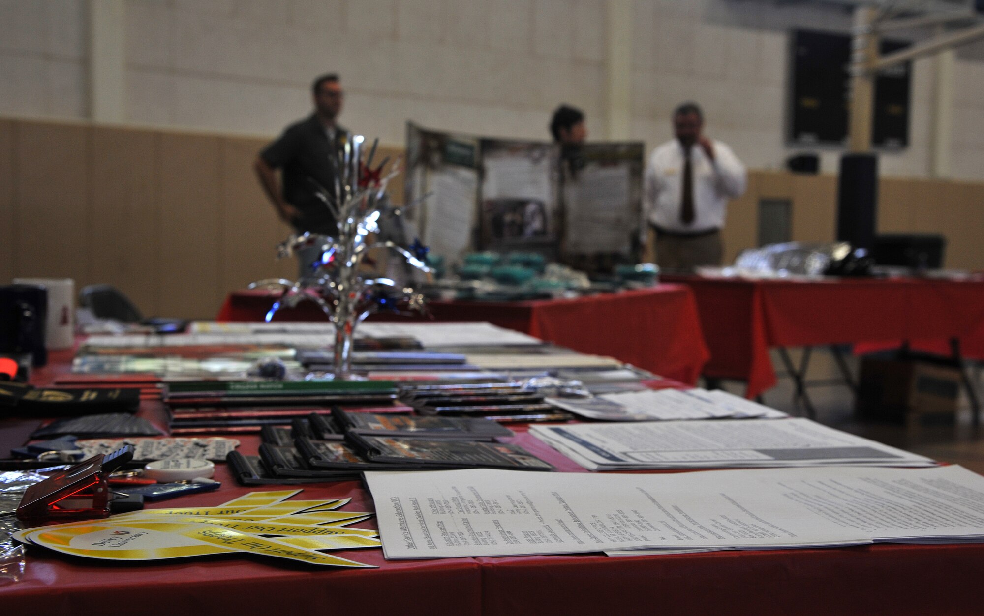 GOODFELLOW AIR FORCE BASE, Texas-- A table set up by the base education office provides helpful information at the Spouse Appreciation Luncheon June 13. Staff members from the base education office, 17th Training Wing Safety, and housing office provided information for service members and spouses. (U.S. Air Force photo/Airman 1st Class Michael Smith)