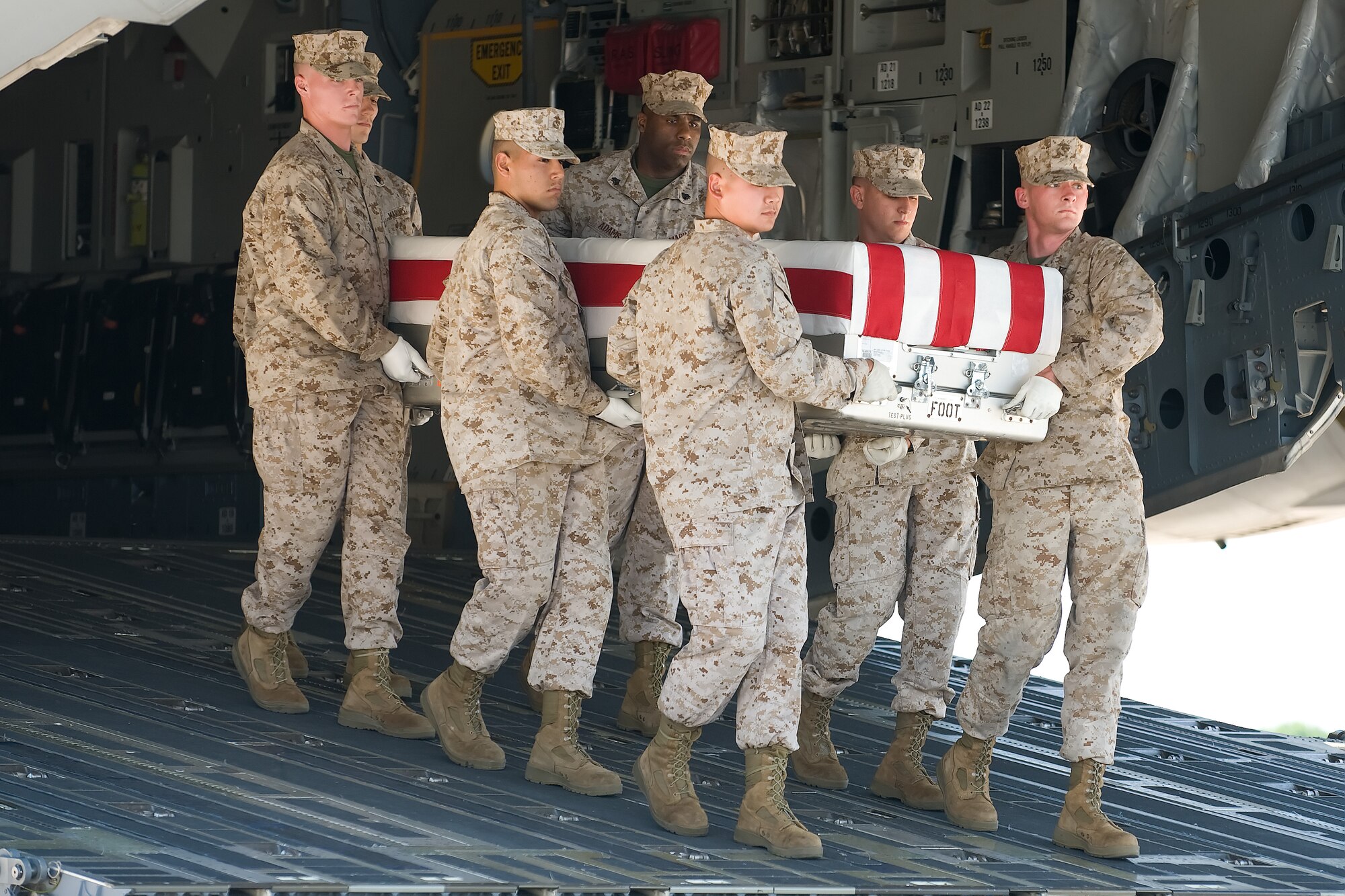 A U.S. Marine Corps carry team transfers the remains of Marine Cpl. Taylor J. Baune of Andover, Minn., at Dover Air Force Base, Del., June 16, 2012. Baune was assigned to 1st Battalion, 7th Marine Regiment, 1st Marine Division, I Marine Expeditionary Force, Twentynine Palms, Calif. (U.S. Air Force photo/Adrian R. Rowan)