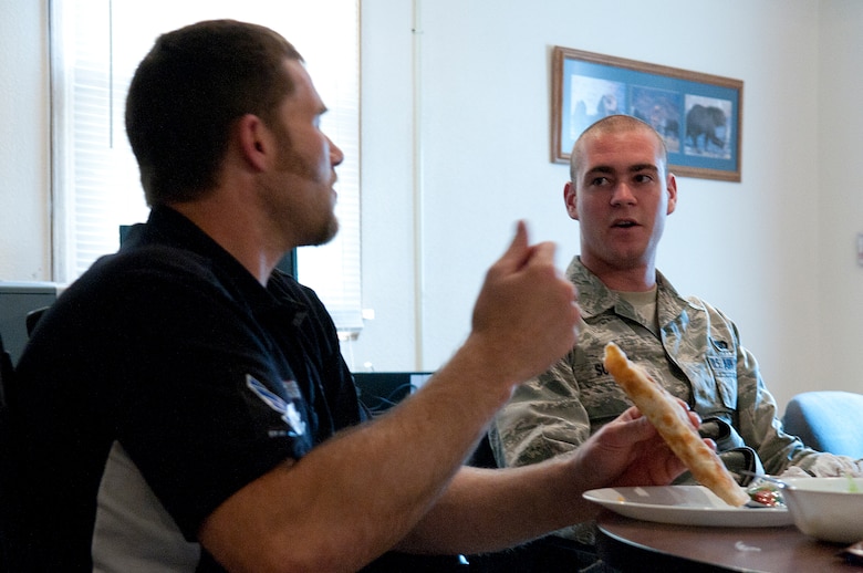 Airman 1st Class Jay Suttor, 790th Missile Security Forces Squadron, visits with Mike Schultz during dinner at Missile Alert Facility N-01 June 10. Schultz was visiting the MAF as part of the Baja 1000, a group of amputee athletes taking part in a resiliency tour conducted by American300 Warrior Tours and presented by Air Force Global Strike Command. Schultz is an above-the-knee amputee who plans on competing in the Baja 1000, an off-road race the length of the Baja California Peninsula, as part of a motorcycle team made up of fellow amputees.  (U.S. Air Force photo by R.J. Oriez)