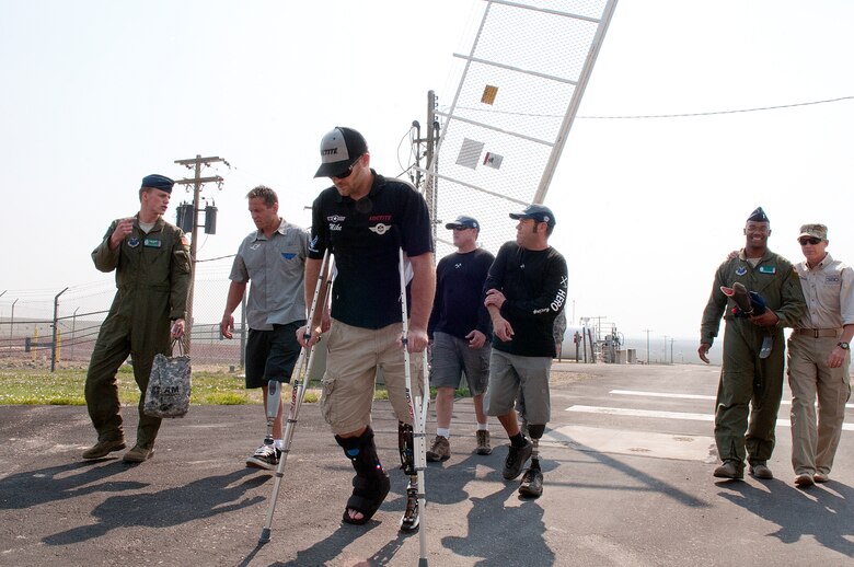 1st. Lt. Edward Warren, 321st Missile Squadron, escorts Jim Wazny, Mike Schultz, Paul Thomas and Chris Ridgeway onto Missile Alert Facility N-01 in Weld County, Colo., June 10. The men, along with Robi Powers, walking with 2nd Lt. Kenneth Jenkins, visited the 90th Missile Wing as part of the Baja 1000, a resiliency tour conducted by Powers’ Amercian300 organization and presented by Air Force Global Strike Command. Ridgway, Wazny and Schultz are amputees who are planning to compete in the Baja 1000, an off-road race the length of the Baja California Peninsula, as part of a motorcycle team coached by Thomas. (U.S. Air Force photo by R.J. Oriez)