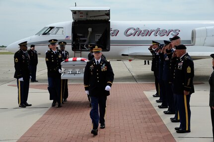 The remains of Spc. Kedith L. Jacobs, 21, of Denver, Colo., arrived at Joint Base San Antonio-Randolph June 18.  Jacobs died May 27 in Chak-E Wardak District, Afghanistan, when his unit was attacked by enemy forces.  He was assigned to Headquarters and Headquarters Company, 2nd Battalion, 5th Infantry Regiment, 3rd Brigade Combat Team, 1st Armored Division, Fort Bliss, Texas.  Funeral services will be held at Colonial Funeral Home in Universal City, Texas, followed by internment at JBSA-Fort Sam Houston Cemetery. People from JBSA-Randolph lined Harmon Drive for the memorial procession through Randolph. (U.S. Air Force Photo by Don Lindsey)

