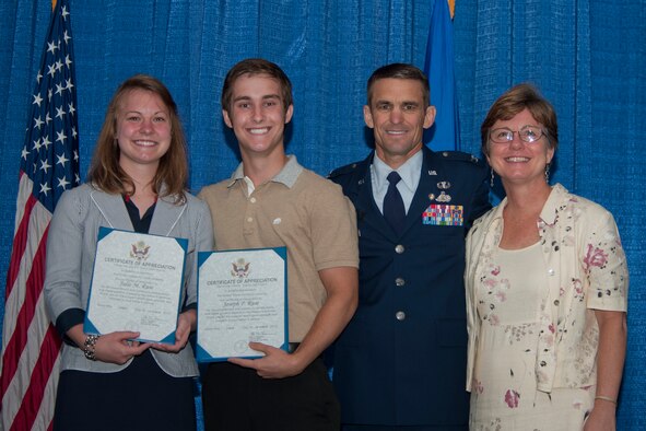 U.S. Air Force Col. Mark Ruse, former 23d Mission Support Group commander, poses for a photo with his children, Julie and Joey, and wife, Lisa, during a retirement ceremony June 15, 2012, at Moody Air Force Base, Ga. Ruse served more than 25 years in the Air Force. During the ceremony, his family was recognized for their commitment in supporting their father and husband. (U.S. Air Force photo by Staff Sgt. Jamal D. Sutter/Released)  