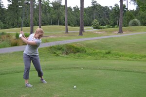 1st Lt. Chelsea Baker, the 510th Human Resources Company, Special Troops Battalion, 7th Sustainment Brigade executive officer, drives a golf ball during the STB golf tournament at The Pines Golf Course at Ft. Eustis, Va., June 14, 2012. (U.S. Army photo by Sgt. Edwin Rodriguez/Released)